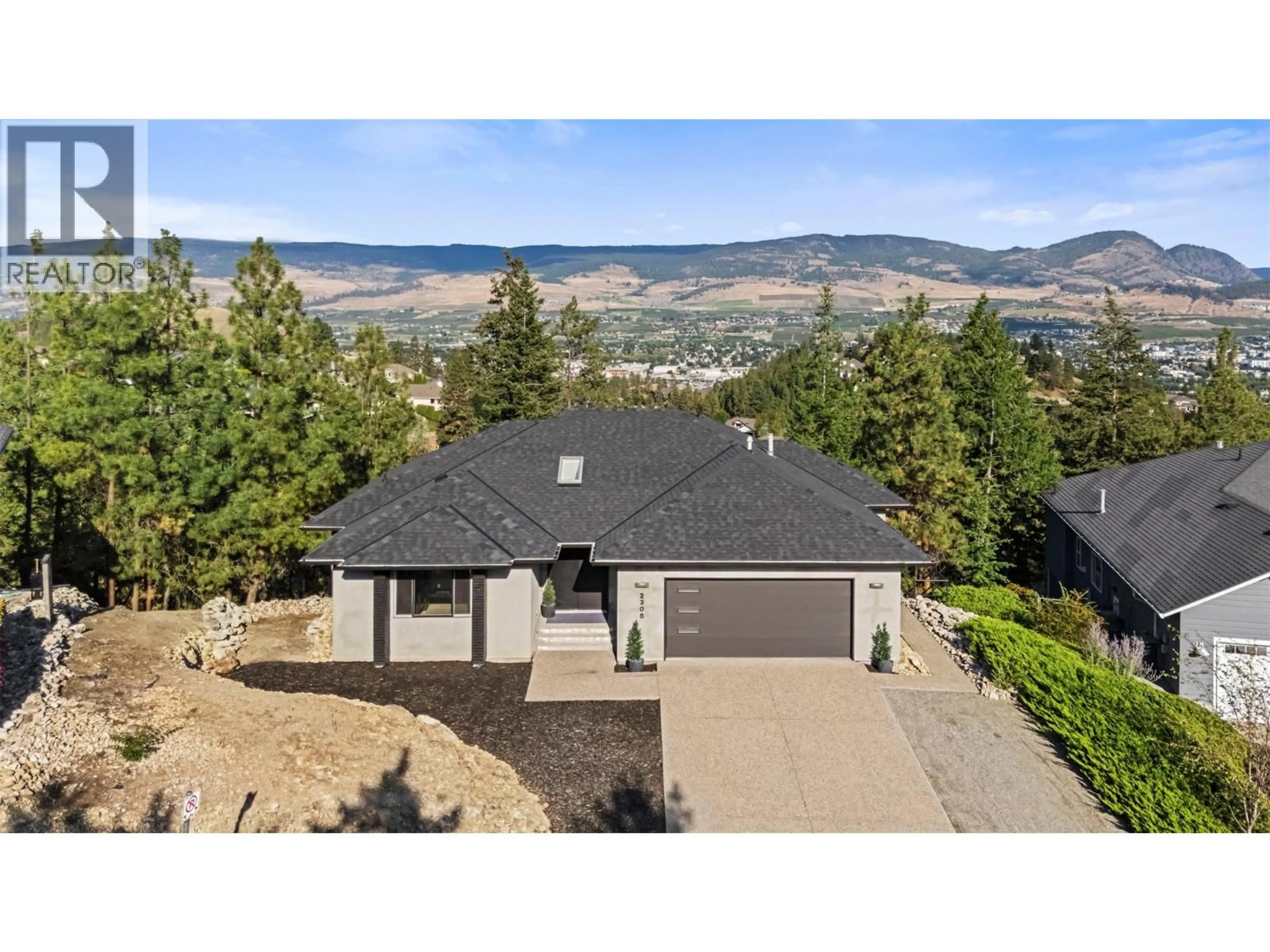 A pic from outside/outdoor area/front of a property/back of a property/a pic from drone, mountain view for 2308 LILLOOET CRESCENT, Kelowna British Columbia V1V1T1