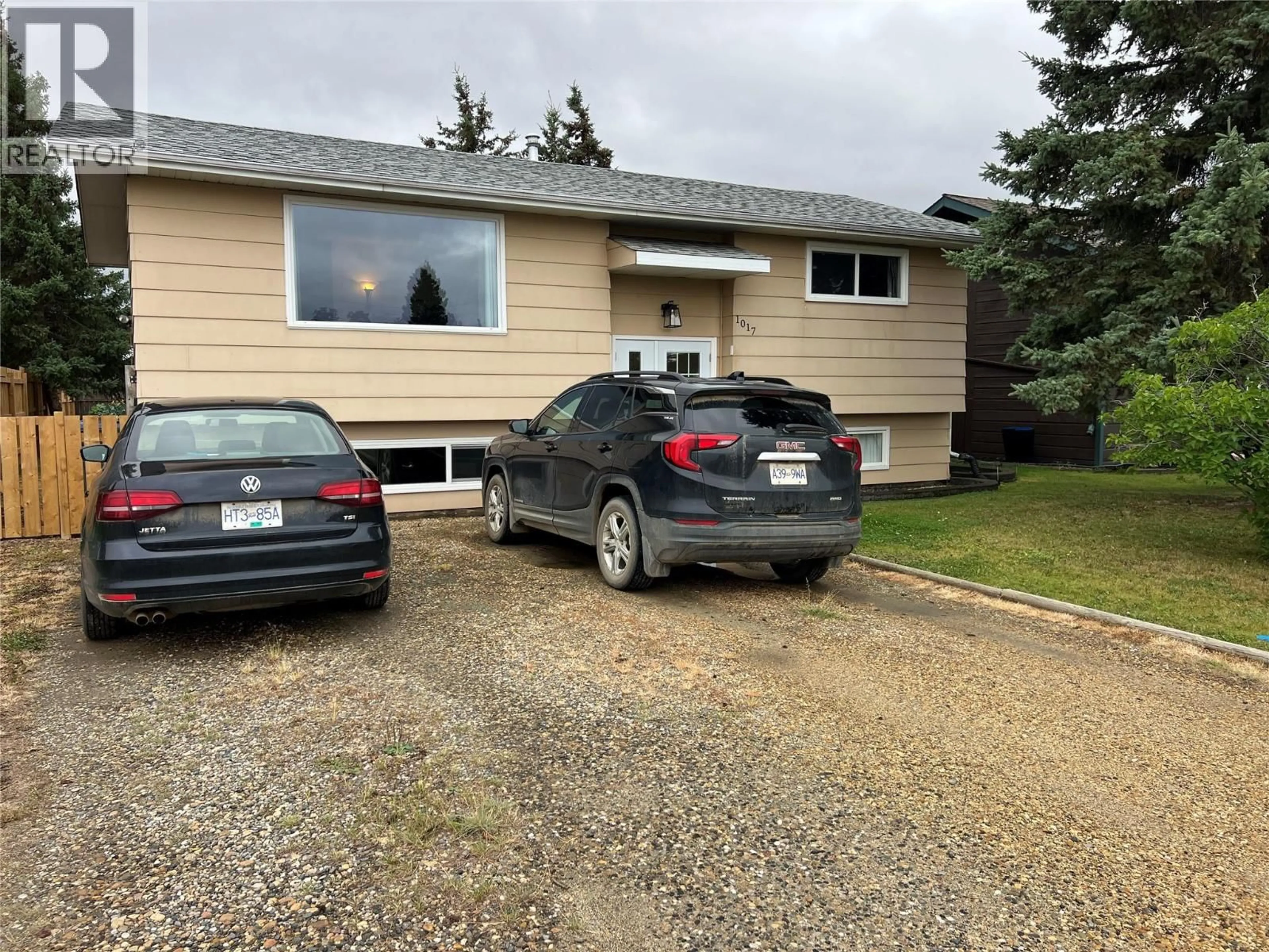 A pic from outside/outdoor area/front of a property/back of a property/a pic from drone, street for 1017 120 AVENUE, Dawson Creek British Columbia V1G3J8