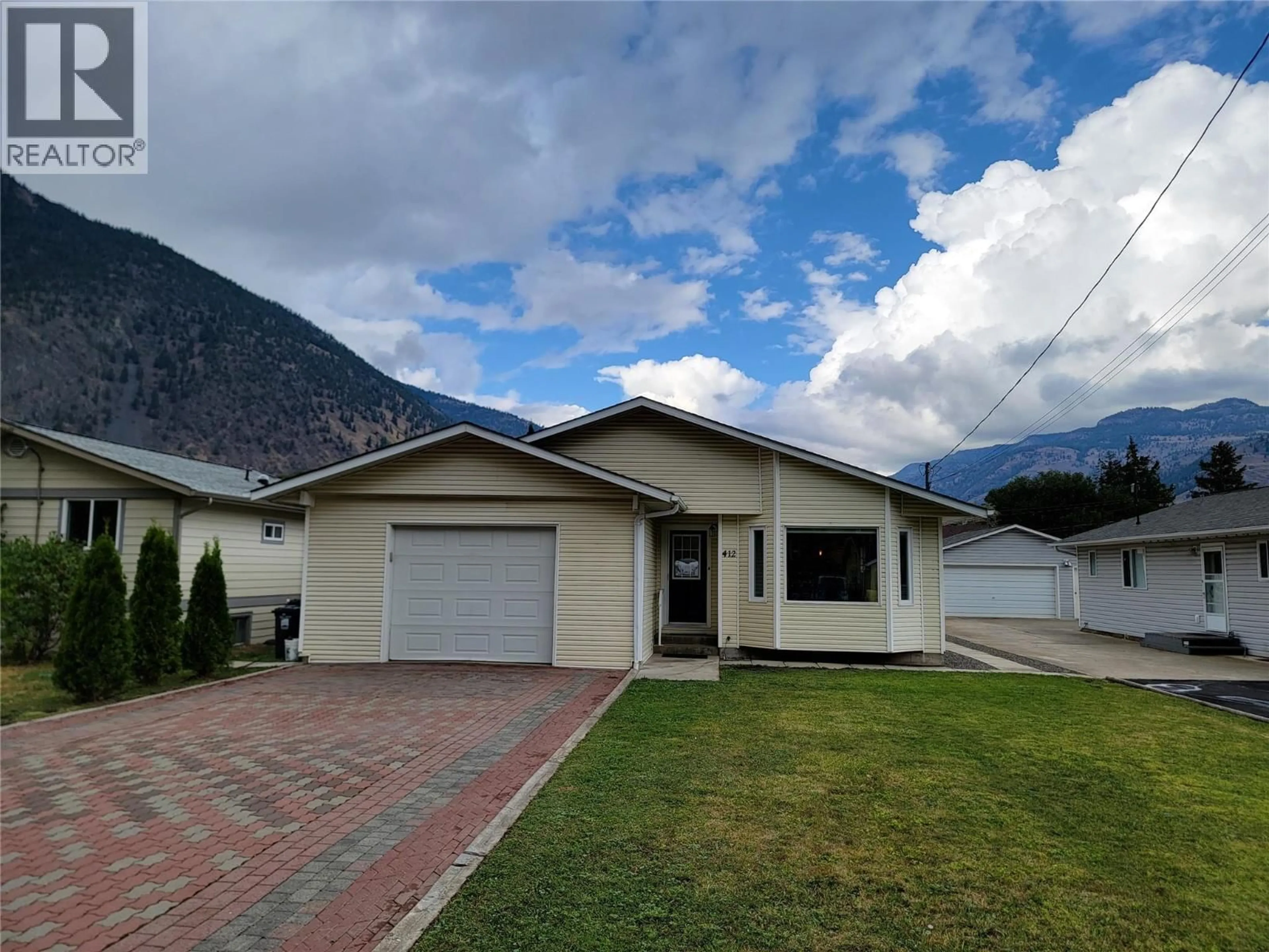 Home with vinyl exterior material, mountain view for 412 10TH AVENUE, Keremeos British Columbia V0X1N3