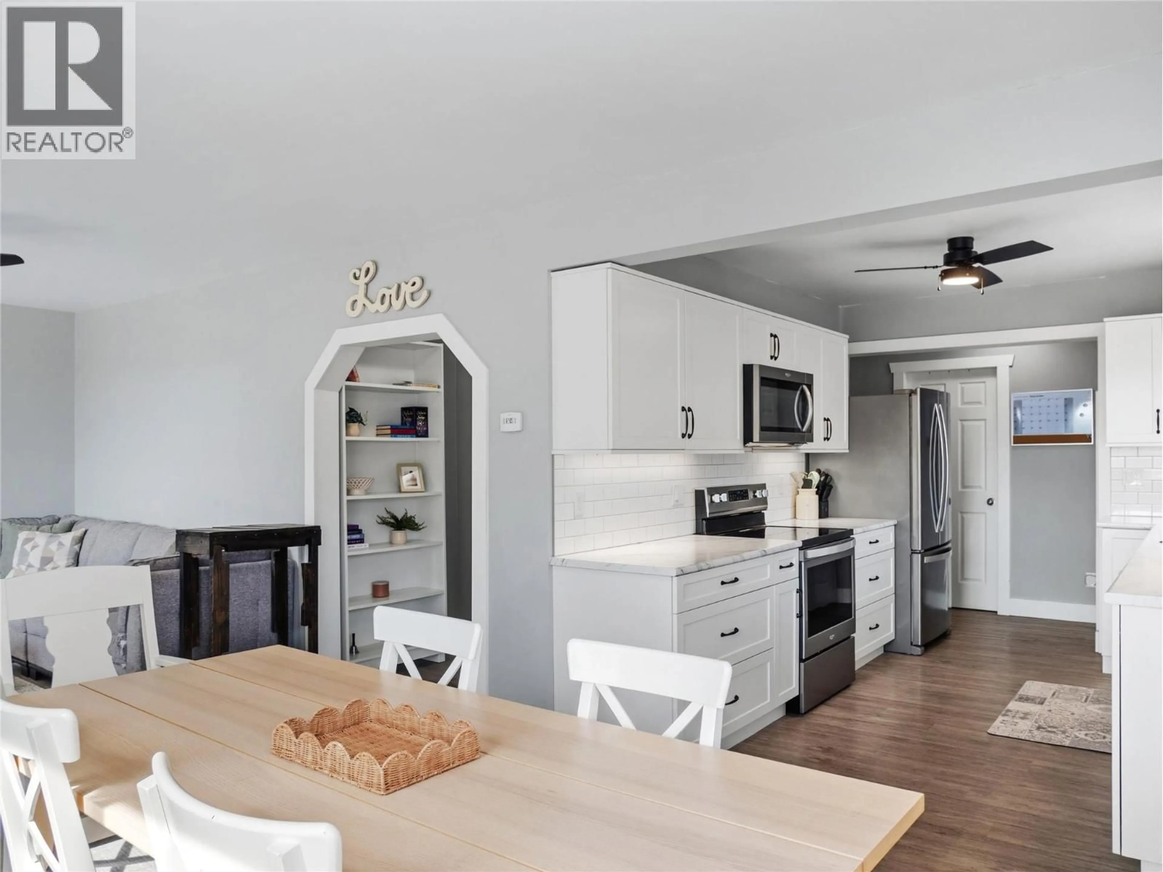 Open concept kitchen, wood/laminate floor for 1400 96 AVENUE, Dawson Creek British Columbia V1G1L5