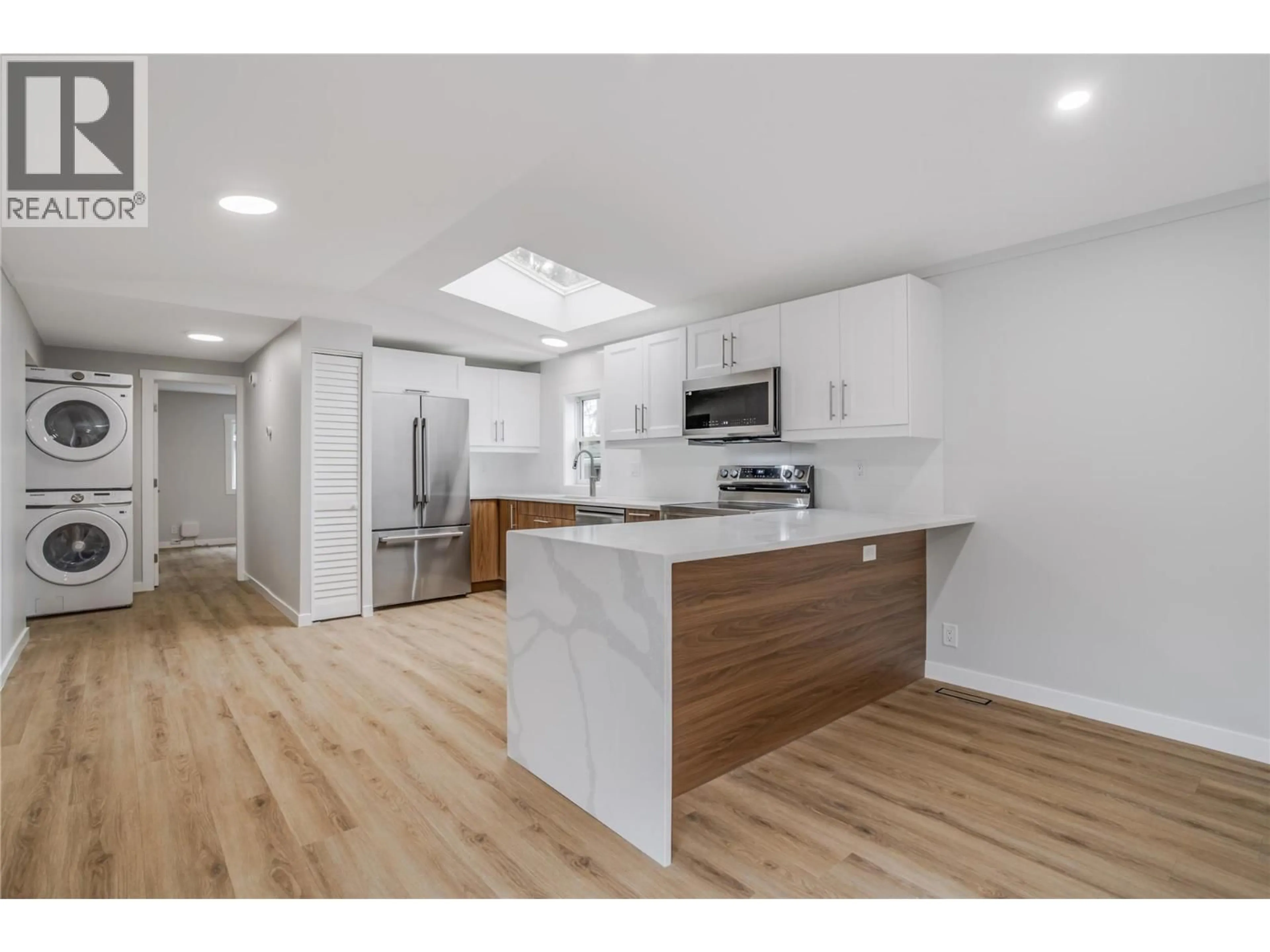 Open concept kitchen, wood/laminate floor for 23 - 3225 SHANNON LAKE ROAD, West Kelowna British Columbia V4T2E2