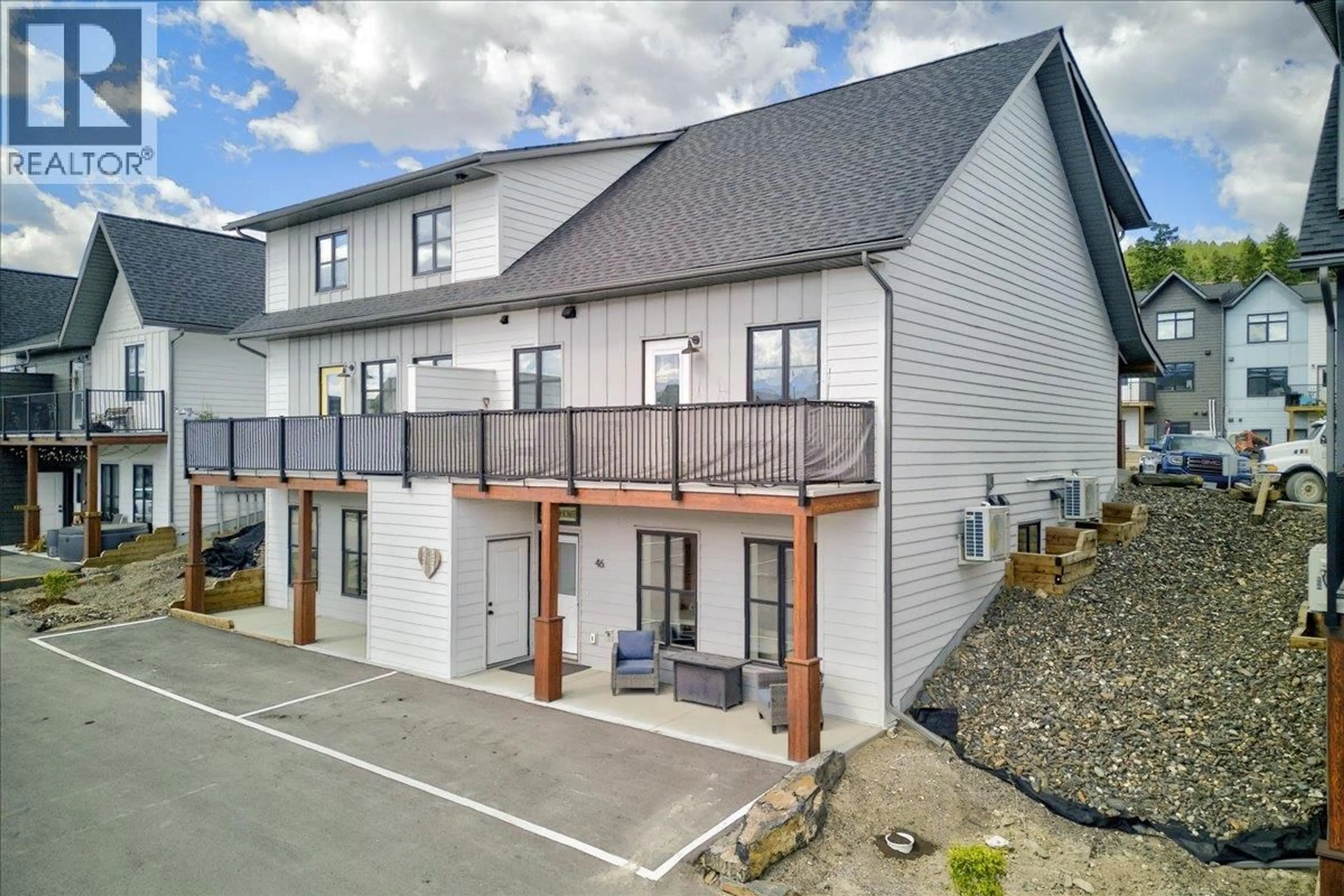 A pic from outside/outdoor area/front of a property/back of a property/a pic from drone, street for 46 - 2098 PINE TREE WAY, Invermere British Columbia V0A1K4