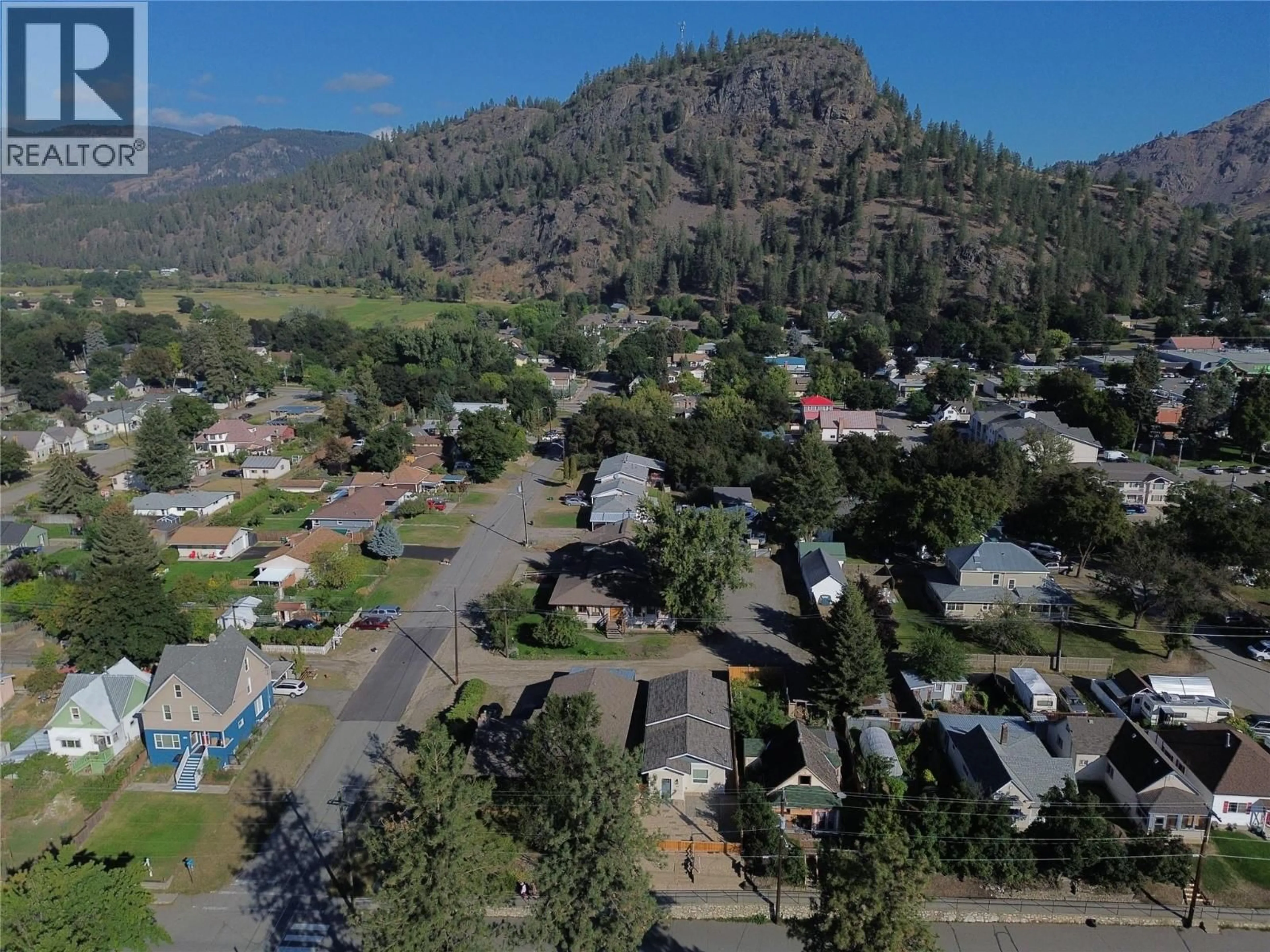 A pic from outside/outdoor area/front of a property/back of a property/a pic from drone, mountain view for 667 72ND AVENUE, Grand Forks British Columbia V0H1H0