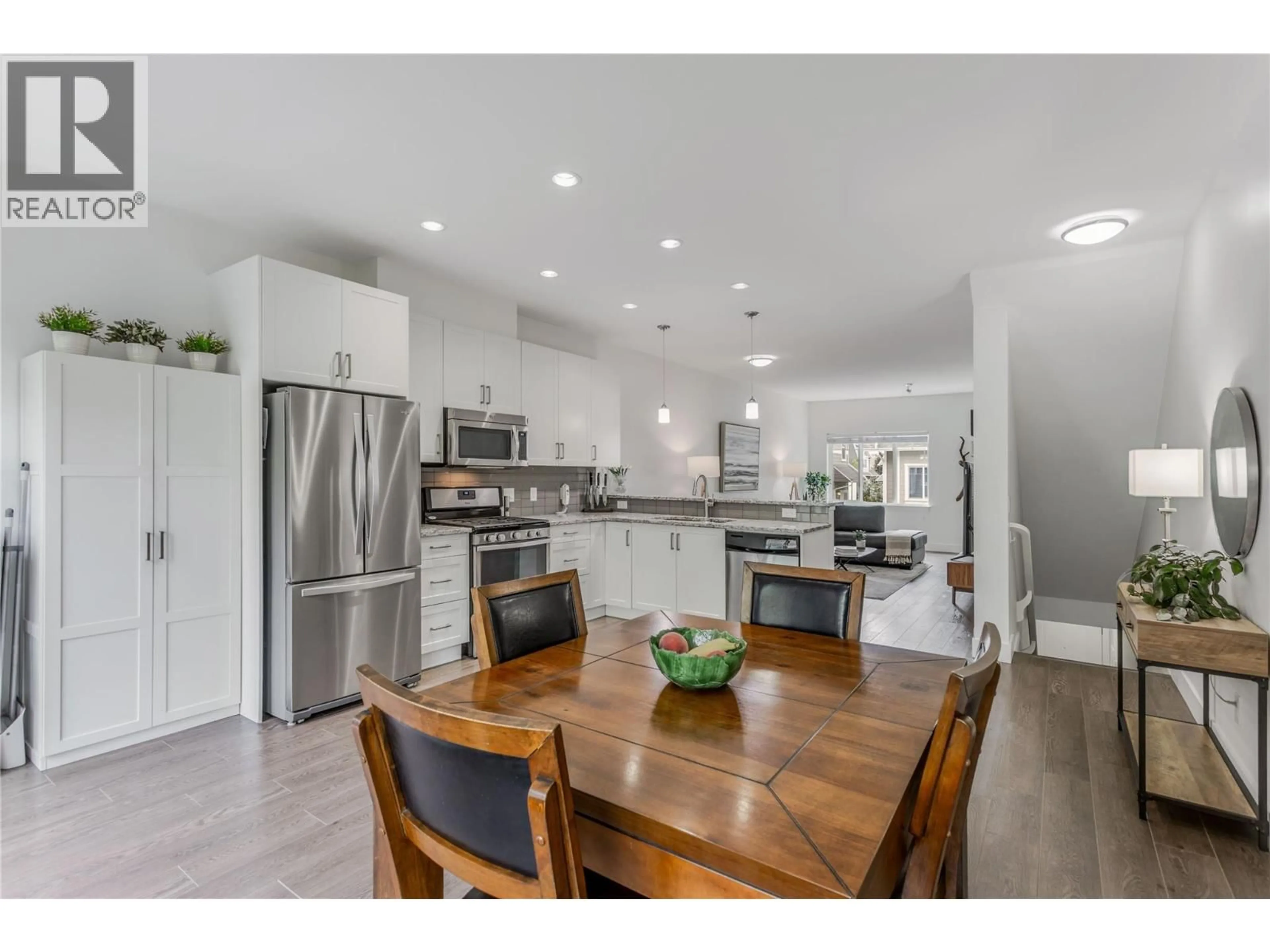 Open concept kitchen, wood/laminate floor for 51 - 600 SHERWOOD ROAD, Kelowna British Columbia V1W5K1