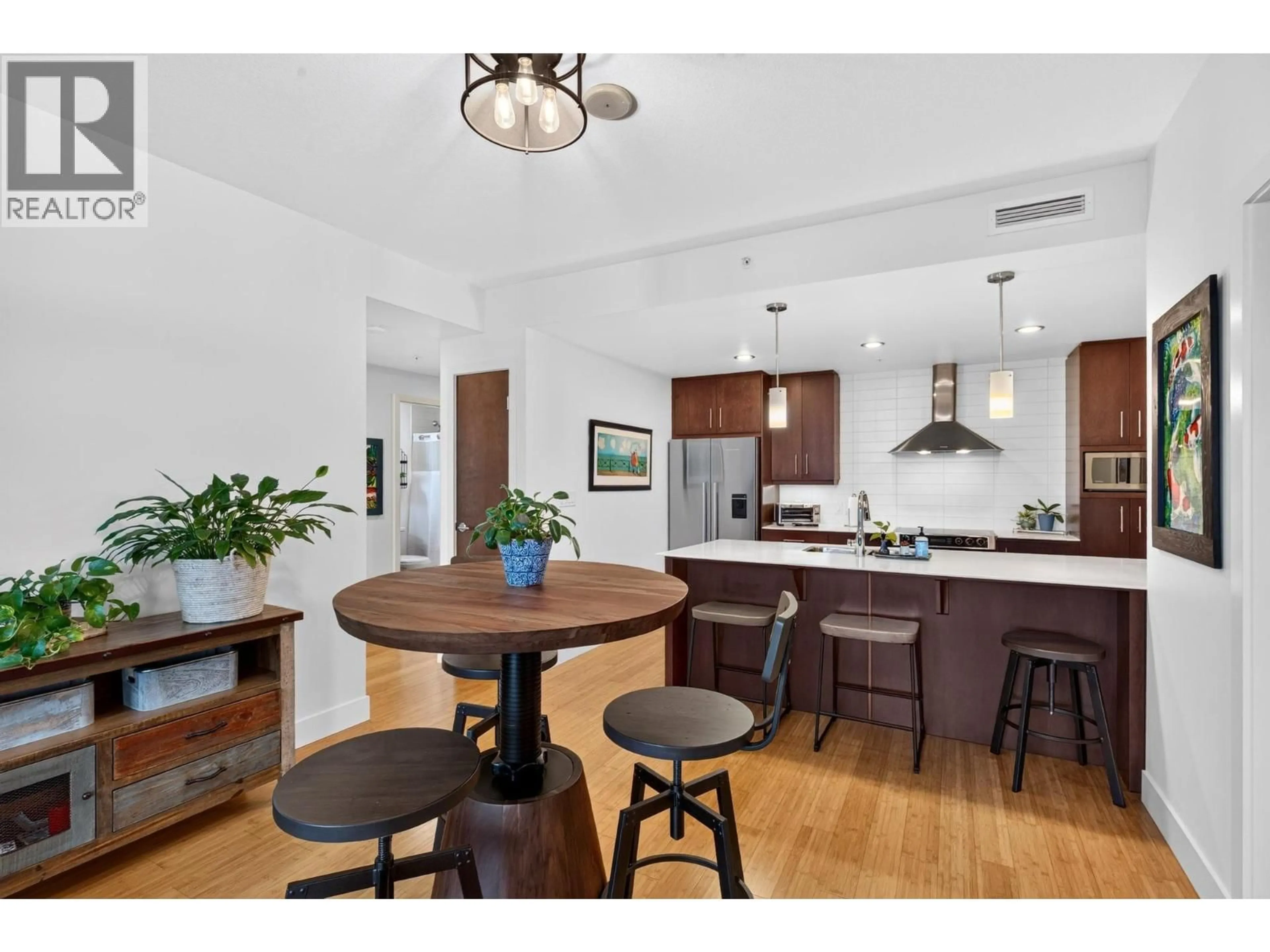 Open concept kitchen, wood/laminate floor for 1003 - 2040 SPRINGFIELD ROAD, Kelowna British Columbia V1Y9N7