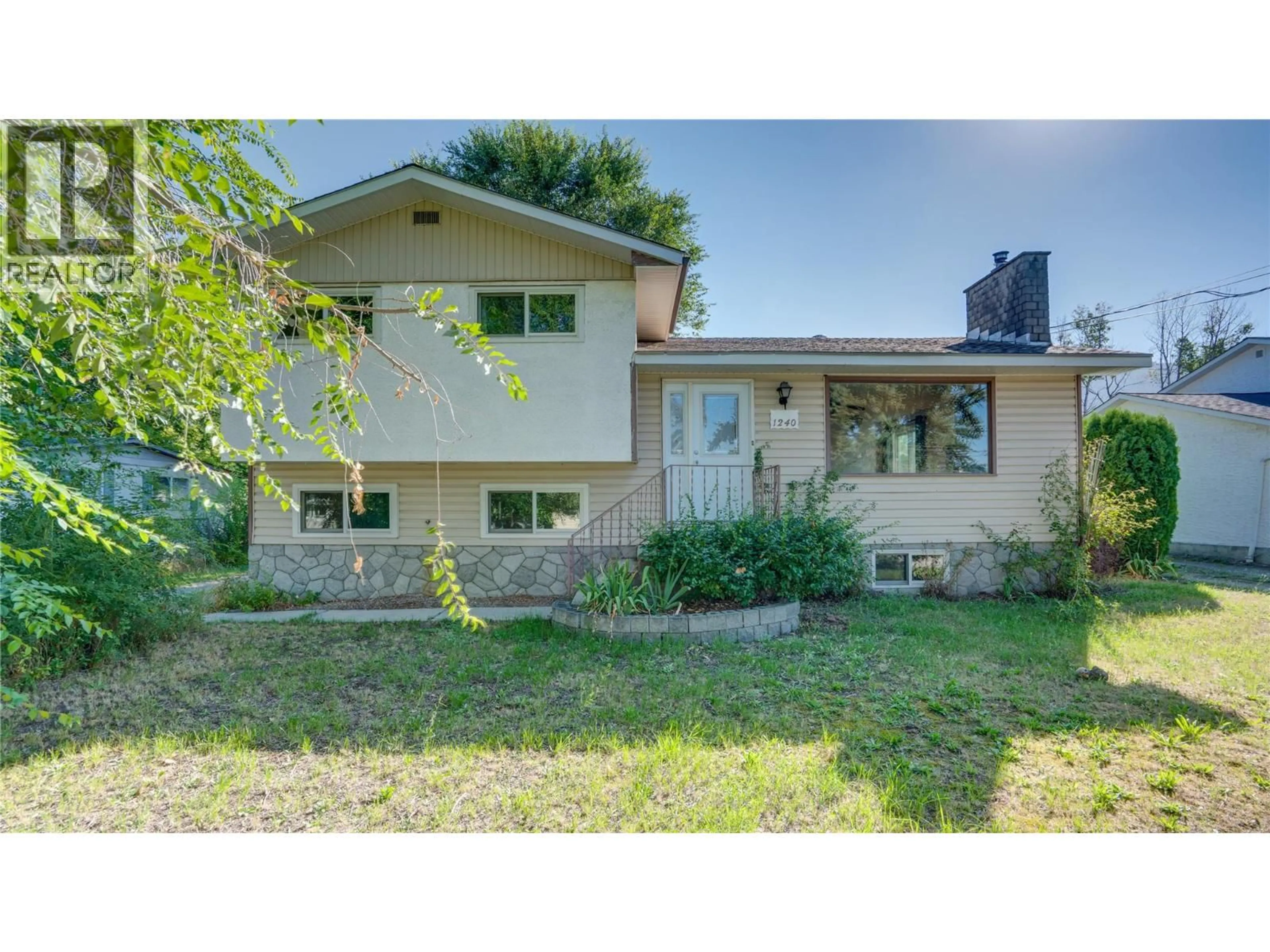 Home with vinyl exterior material, street for 1240 SERENE DRIVE, Spallumcheen British Columbia V4Y0N9