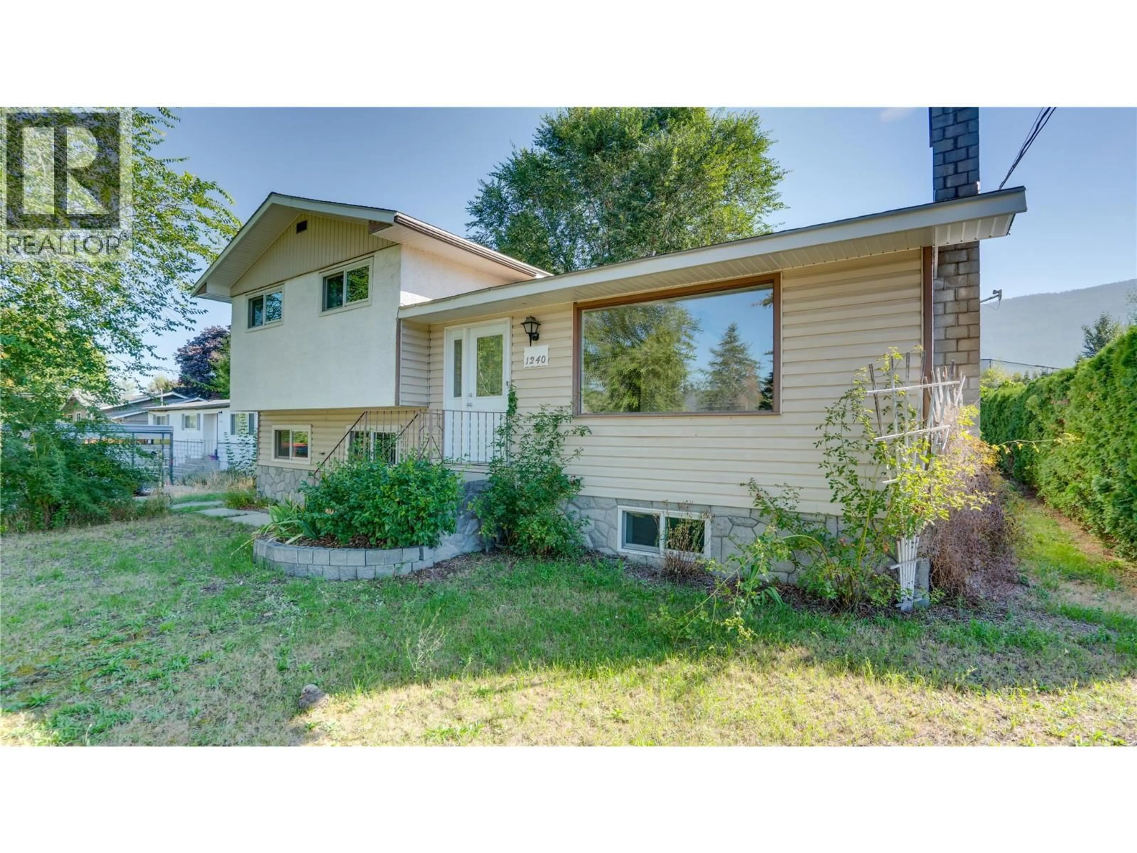 Home with vinyl exterior material, street for 1240 SERENE DRIVE, Spallumcheen British Columbia V4Y0N9