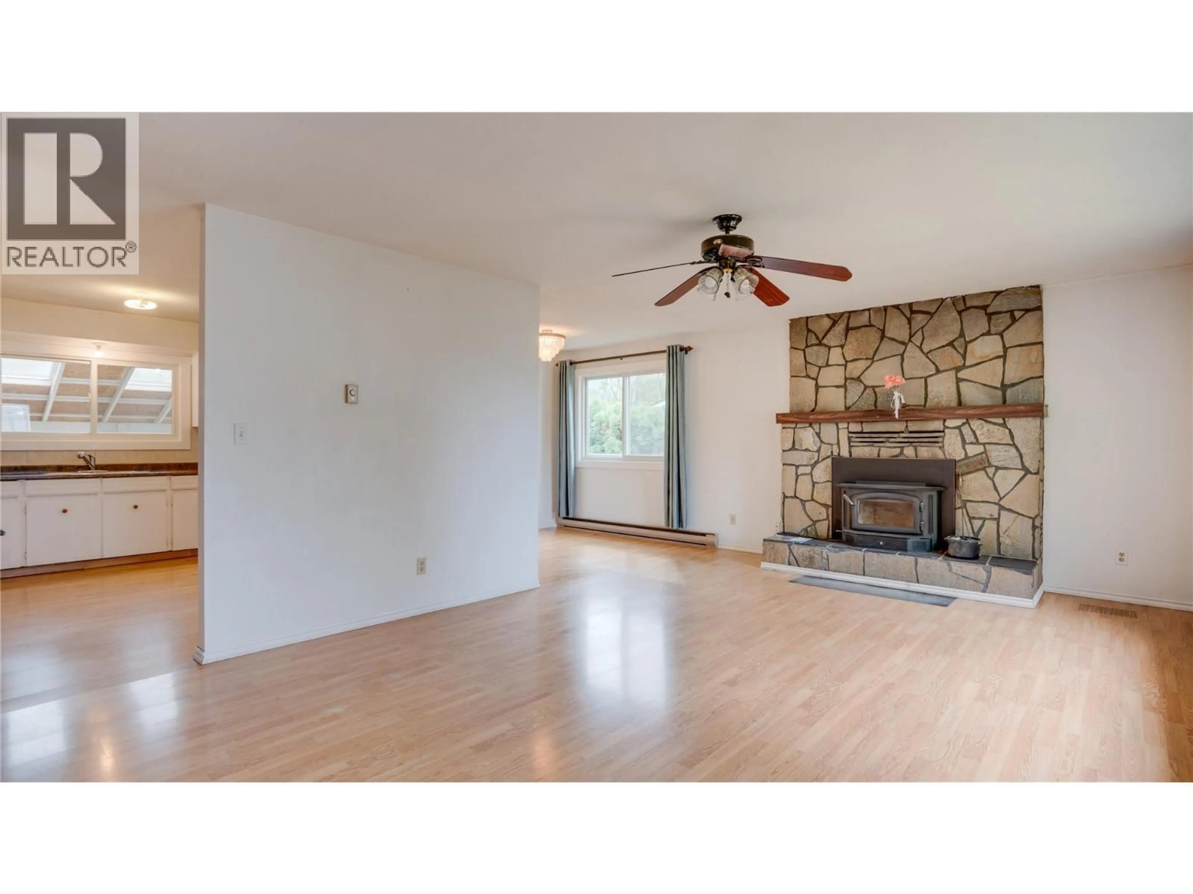 Living room with furniture, wood/laminate floor for 1240 SERENE DRIVE, Spallumcheen British Columbia V4Y0N9
