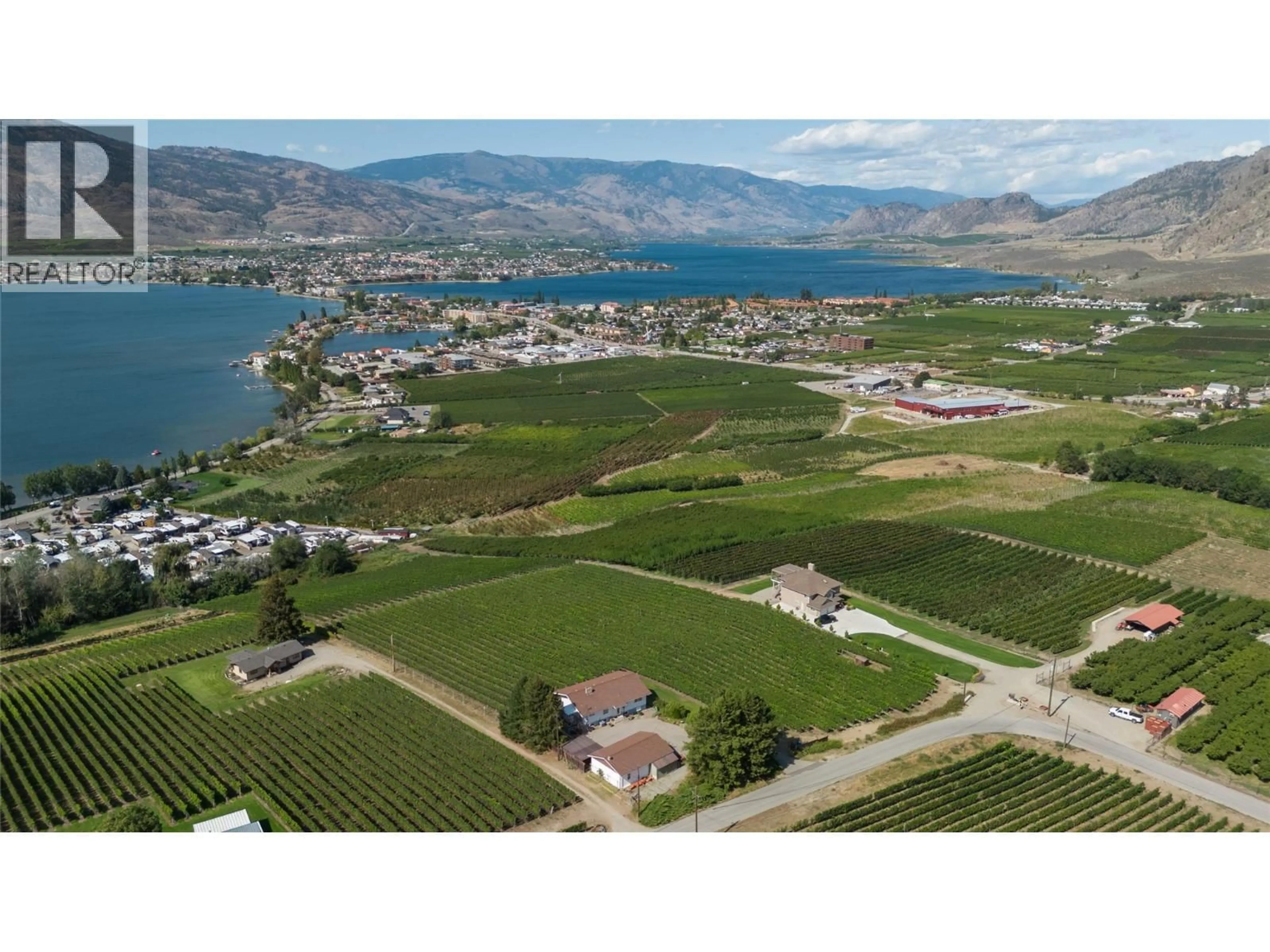 A pic from outside/outdoor area/front of a property/back of a property/a pic from drone, water/lake/river/ocean view for 5012 33RD STREET, Osoyoos British Columbia V0H1V6