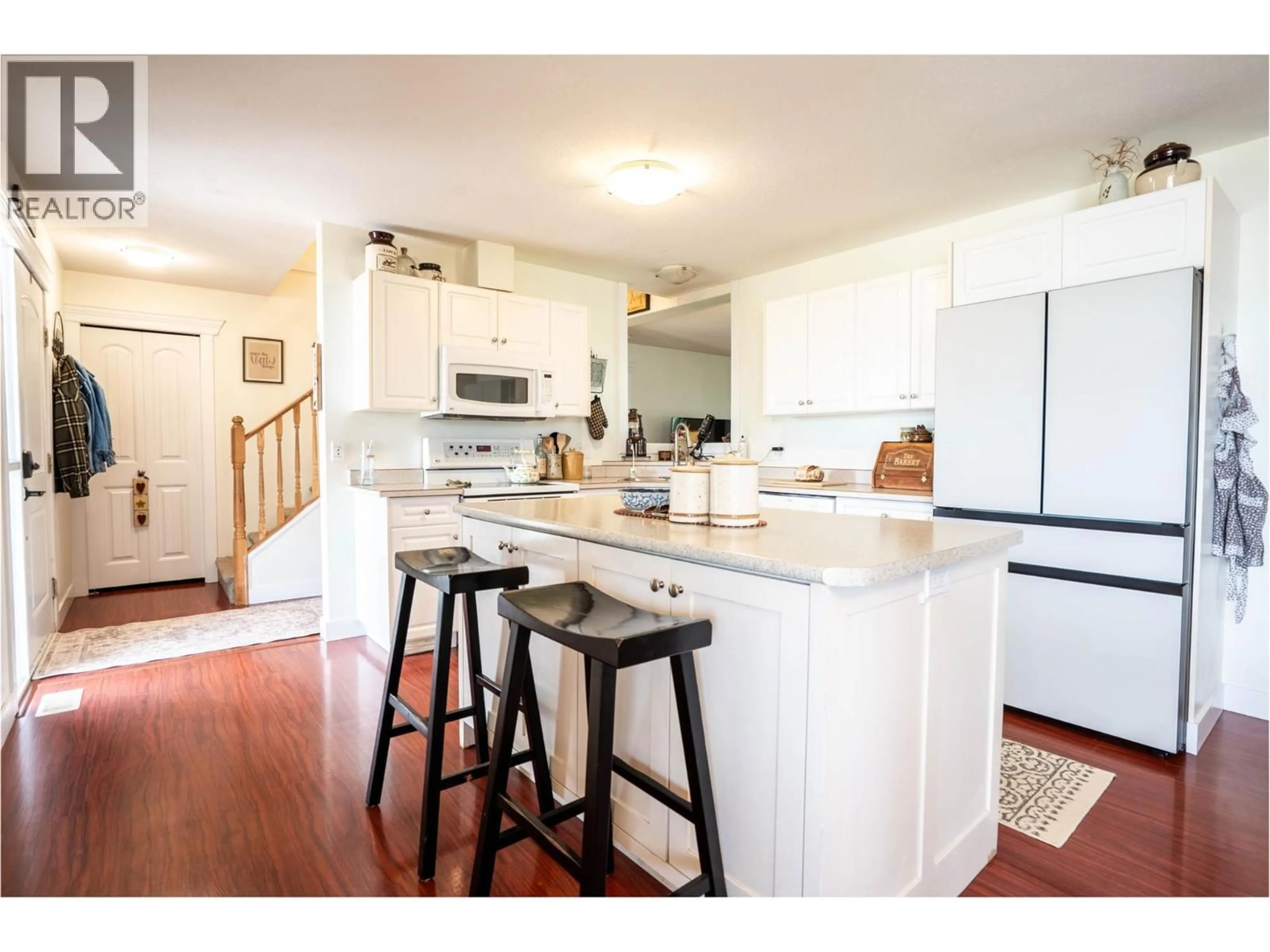 Open concept kitchen, wood/laminate floor for 2328 WILLGOOSE ROAD, Merritt British Columbia V1K1N7