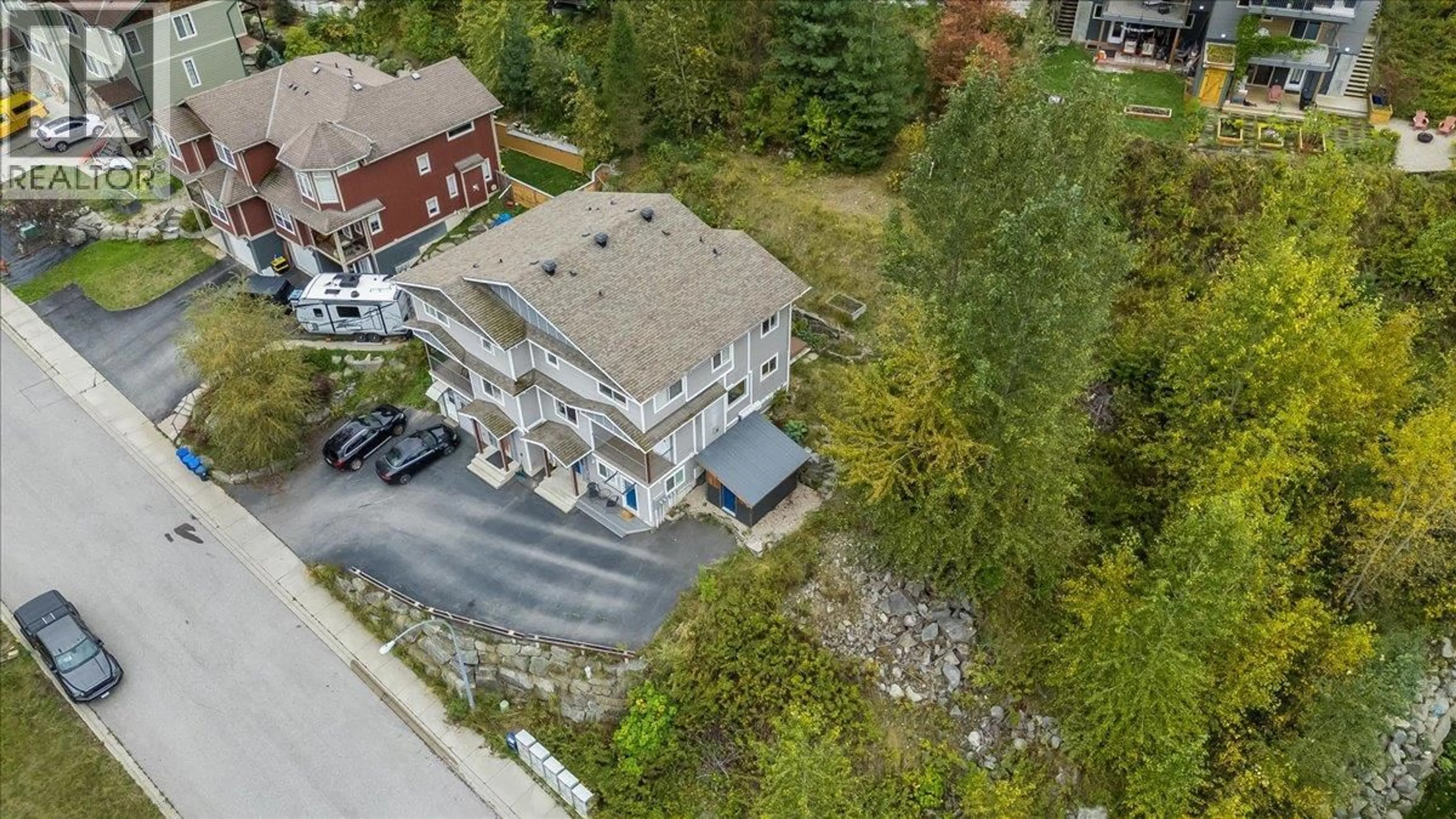 A pic from outside/outdoor area/front of a property/back of a property/a pic from drone, street for A - 2410 PERRIER LANE, Nelson British Columbia V1L7C3