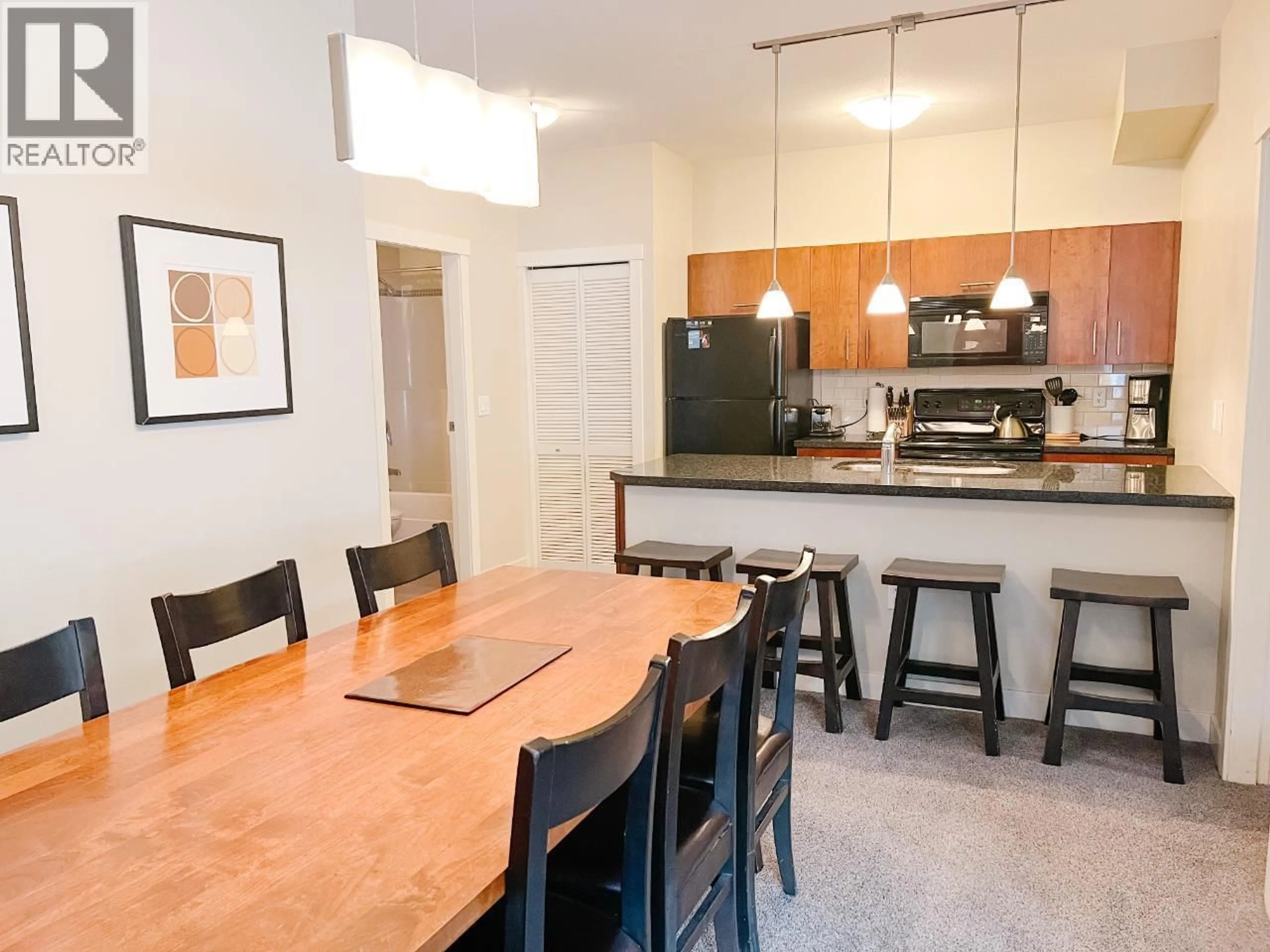Open concept kitchen, wood/laminate floor for 115D - 2049 SUMMIT DRIVE, Panorama British Columbia V0A1T0