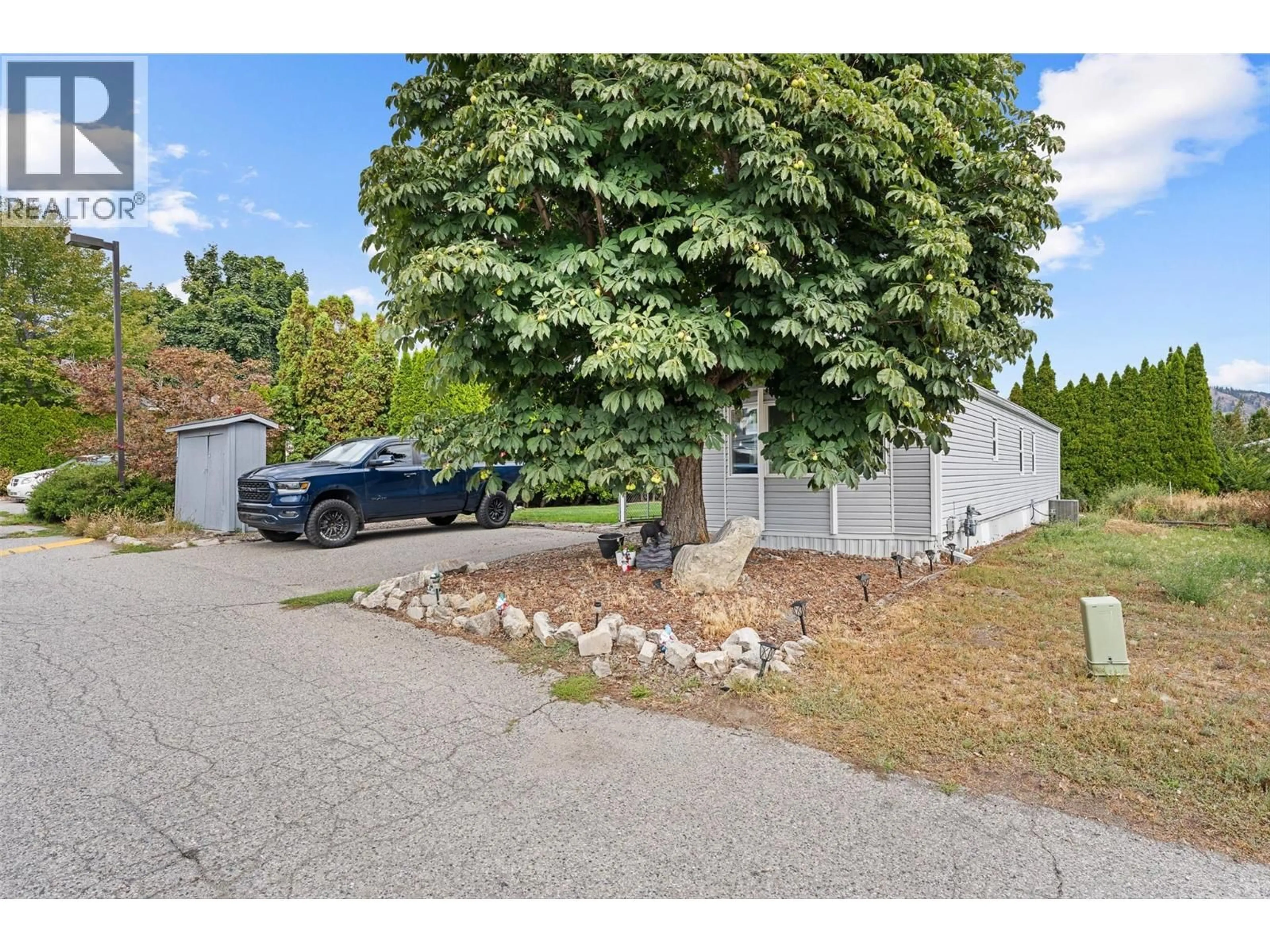 A pic from outside/outdoor area/front of a property/back of a property/a pic from drone, street for 47 - 3381 VILLAGE GREEN WAY, Westbank British Columbia V4T1L2