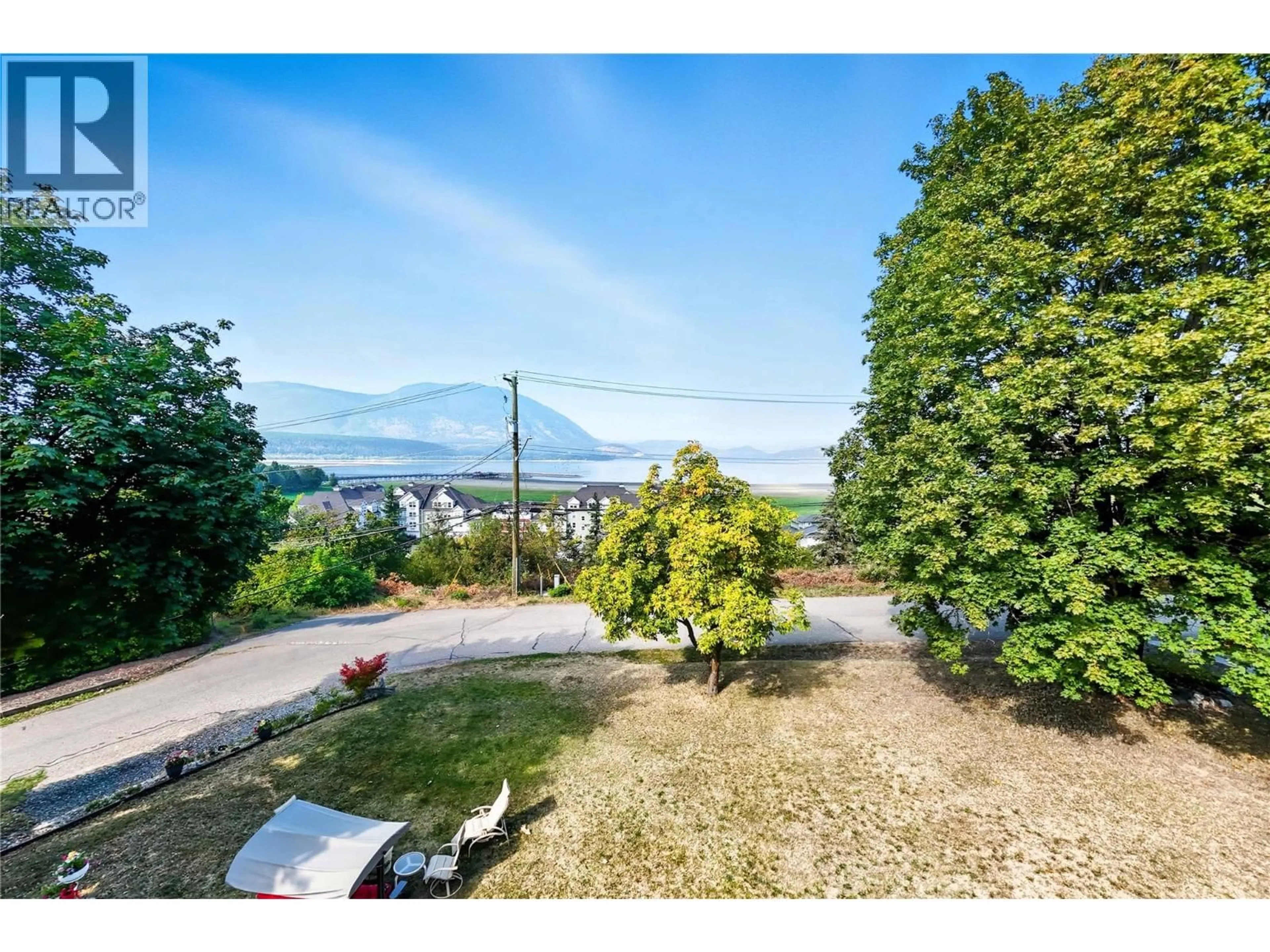 A pic from outside/outdoor area/front of a property/back of a property/a pic from drone, mountain view for 730 9 AVENUE NORTHEAST, Salmon Arm British Columbia V1E4A1