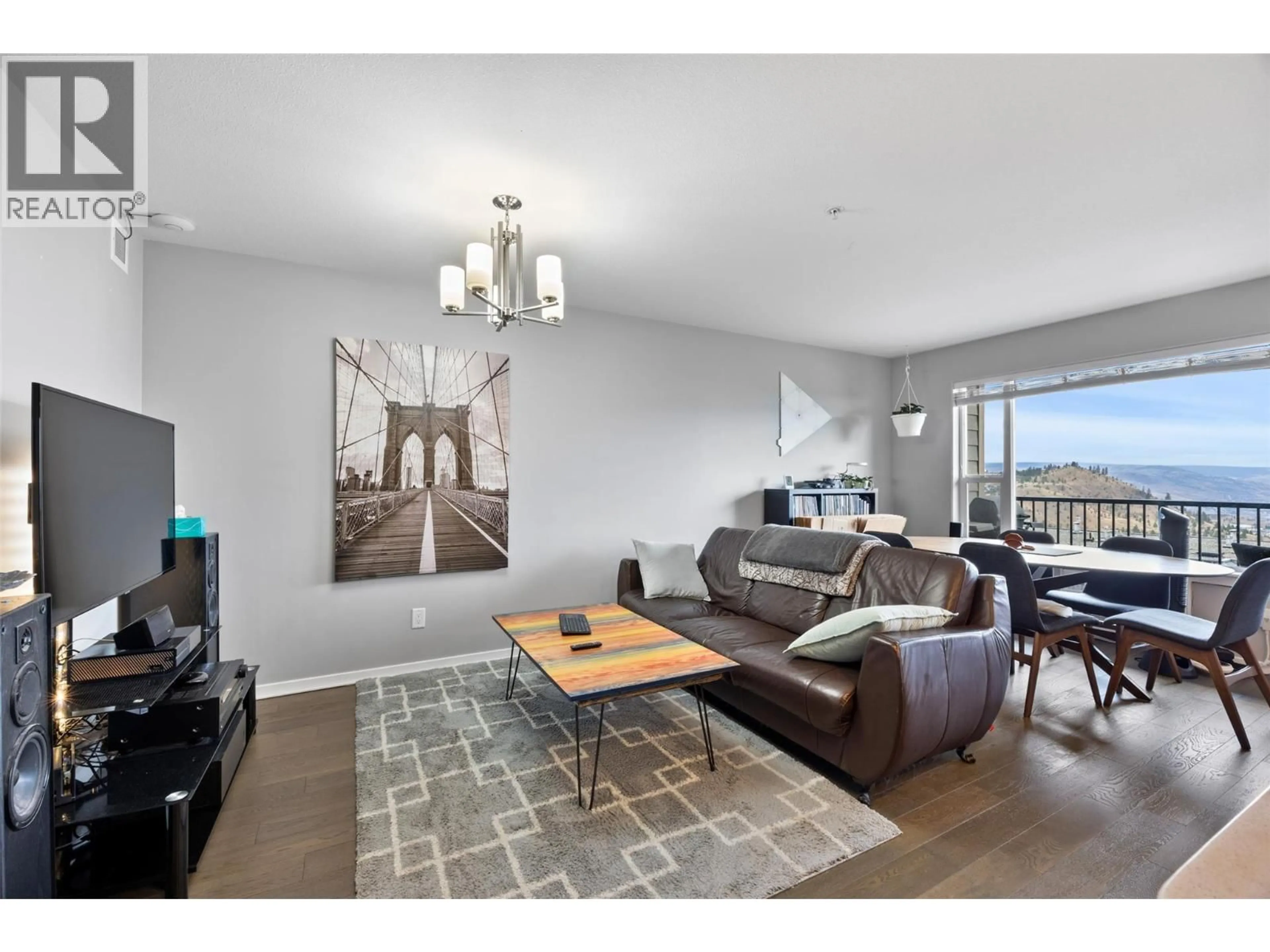 Living room with furniture, wood/laminate floor for 204 - 1200 HARRISON PLACE, Kamloops British Columbia V1S1M1