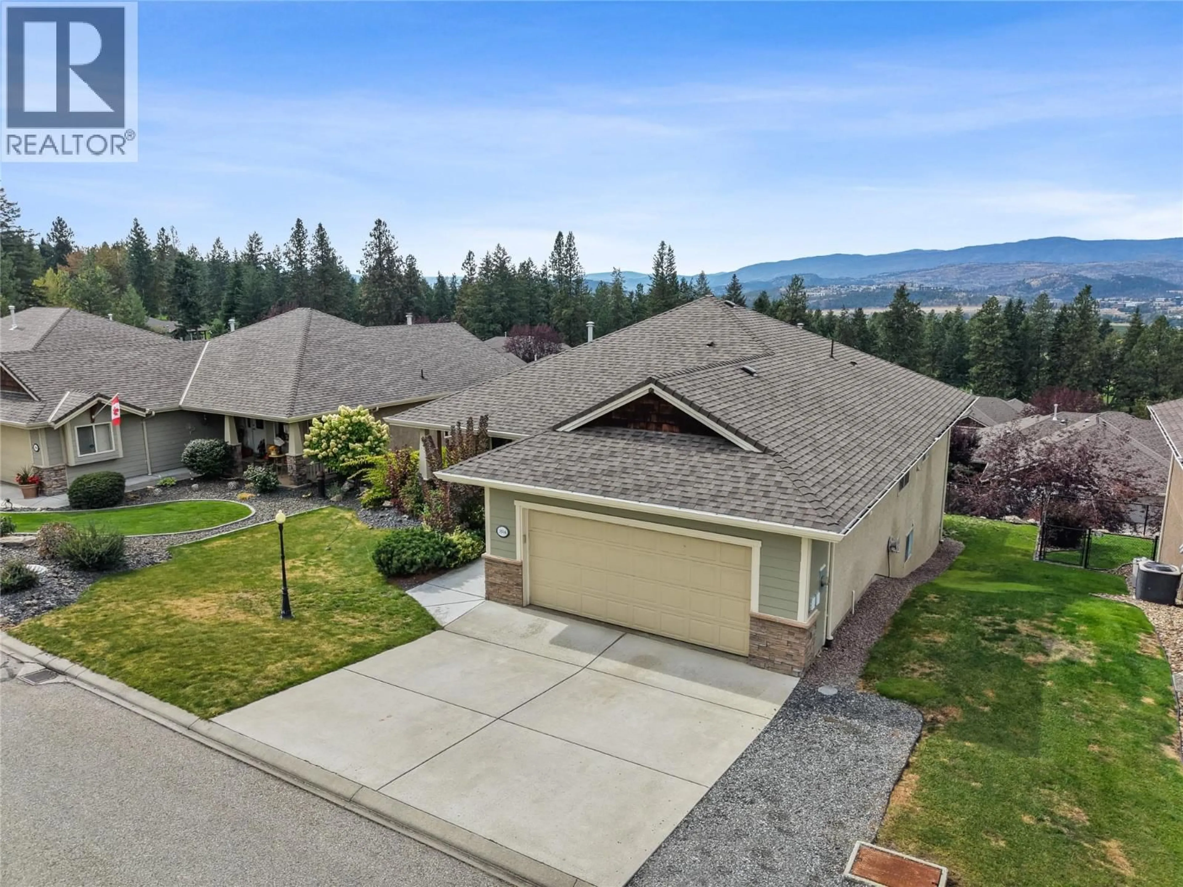 A pic from outside/outdoor area/front of a property/back of a property/a pic from drone, mountain view for 3516 CAMELBACK DRIVE, Kelowna British Columbia V1X8A7