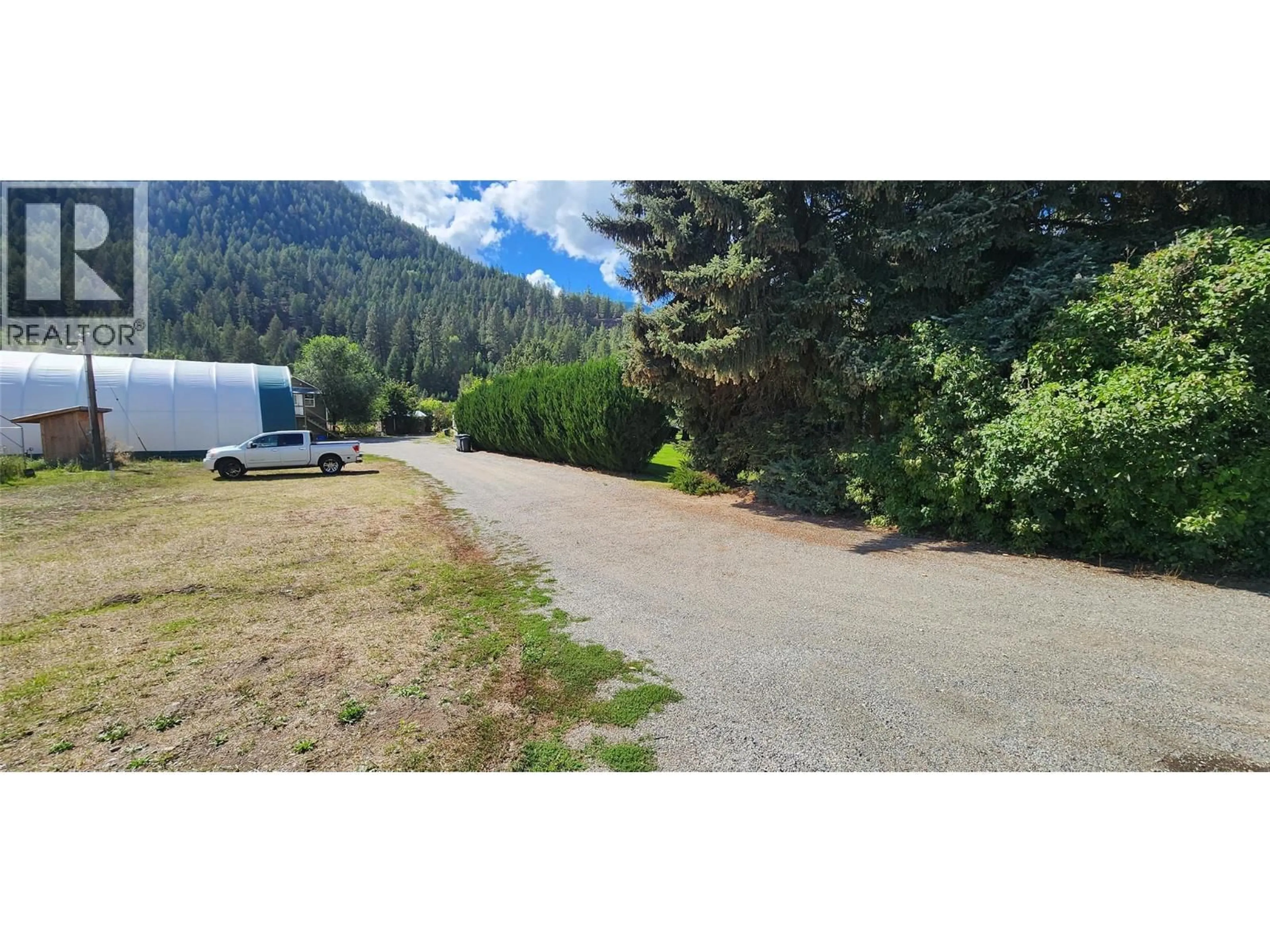 A pic from outside/outdoor area/front of a property/back of a property/a pic from drone, mountain view for 610 GILPIN ROAD, Grand Forks British Columbia V0H1H9