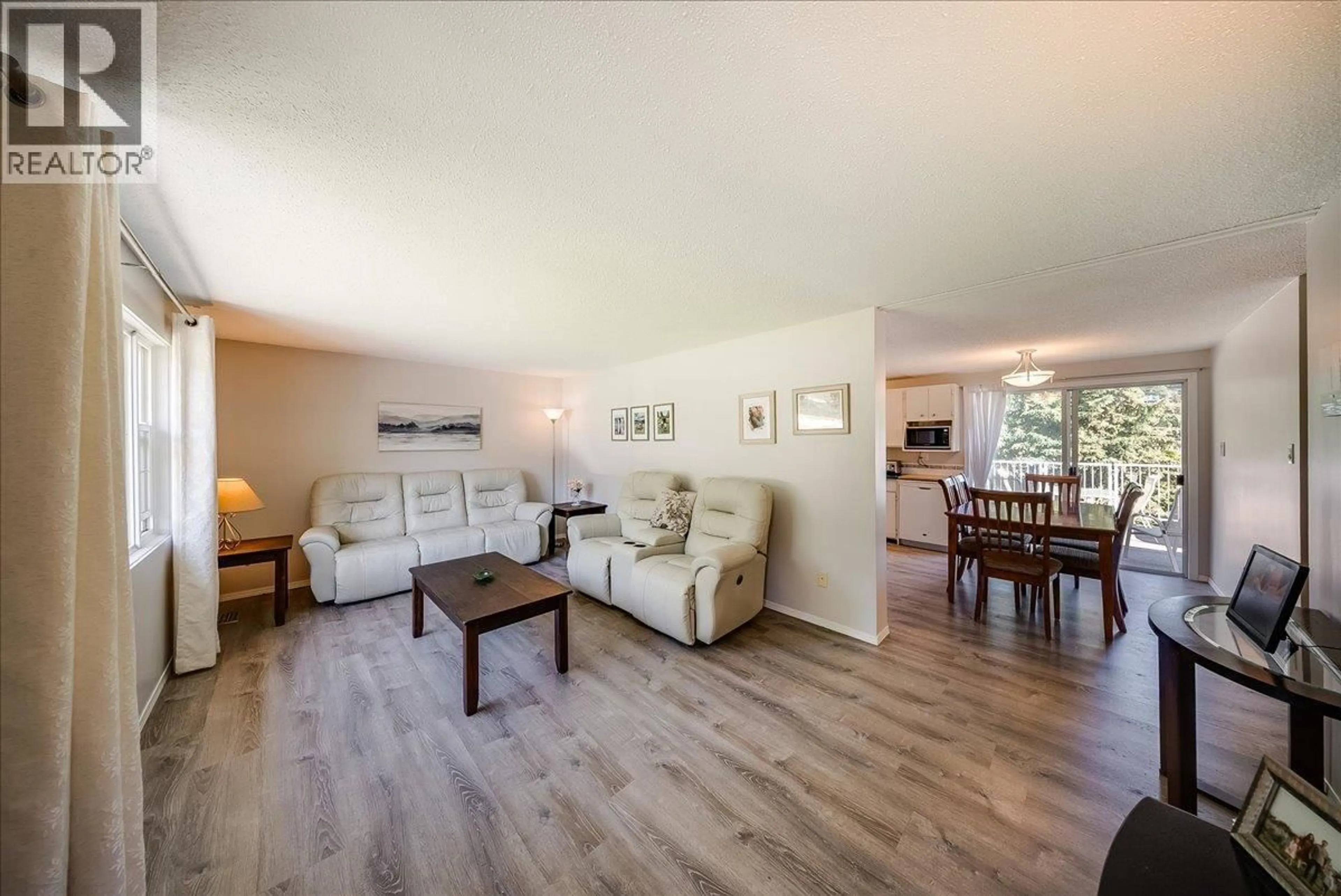 Living room with furniture, wood/laminate floor for 1618 VICTORIA AVENUE, Rossland British Columbia V0G1Y0