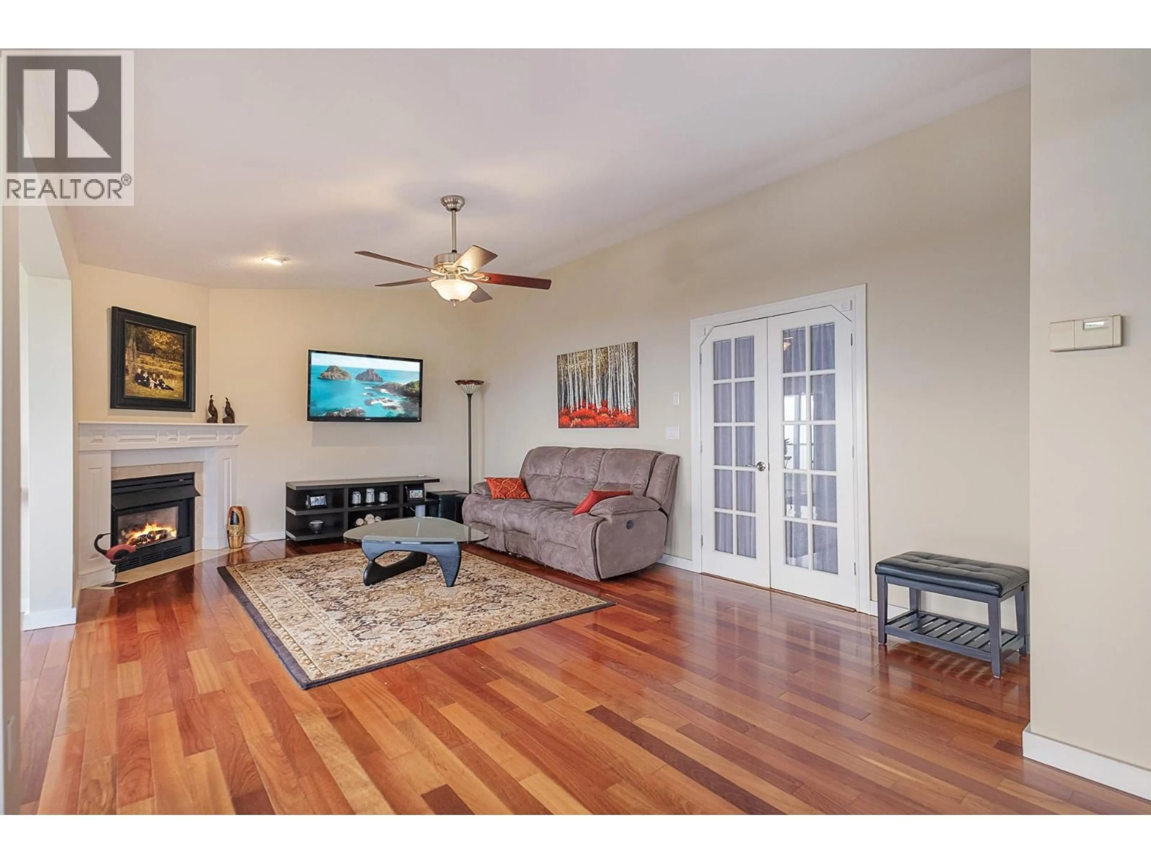 Living room with furniture, wood/laminate floor for 3537 GATES ROAD, West Kelowna British Columbia V4T1A2