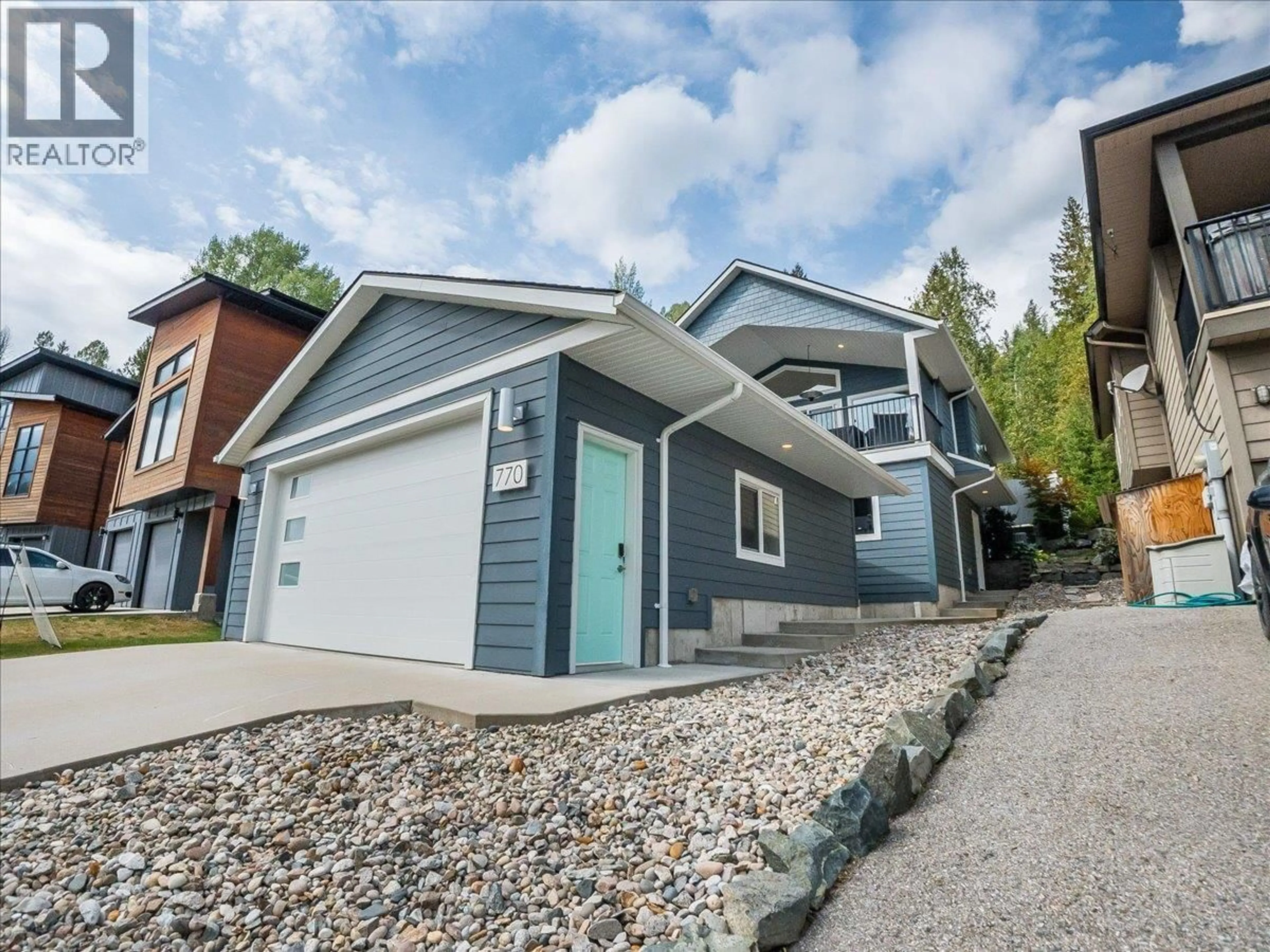 Home with vinyl exterior material, street for 770 REDSTONE DRIVE, Rossland British Columbia V0G1Y0