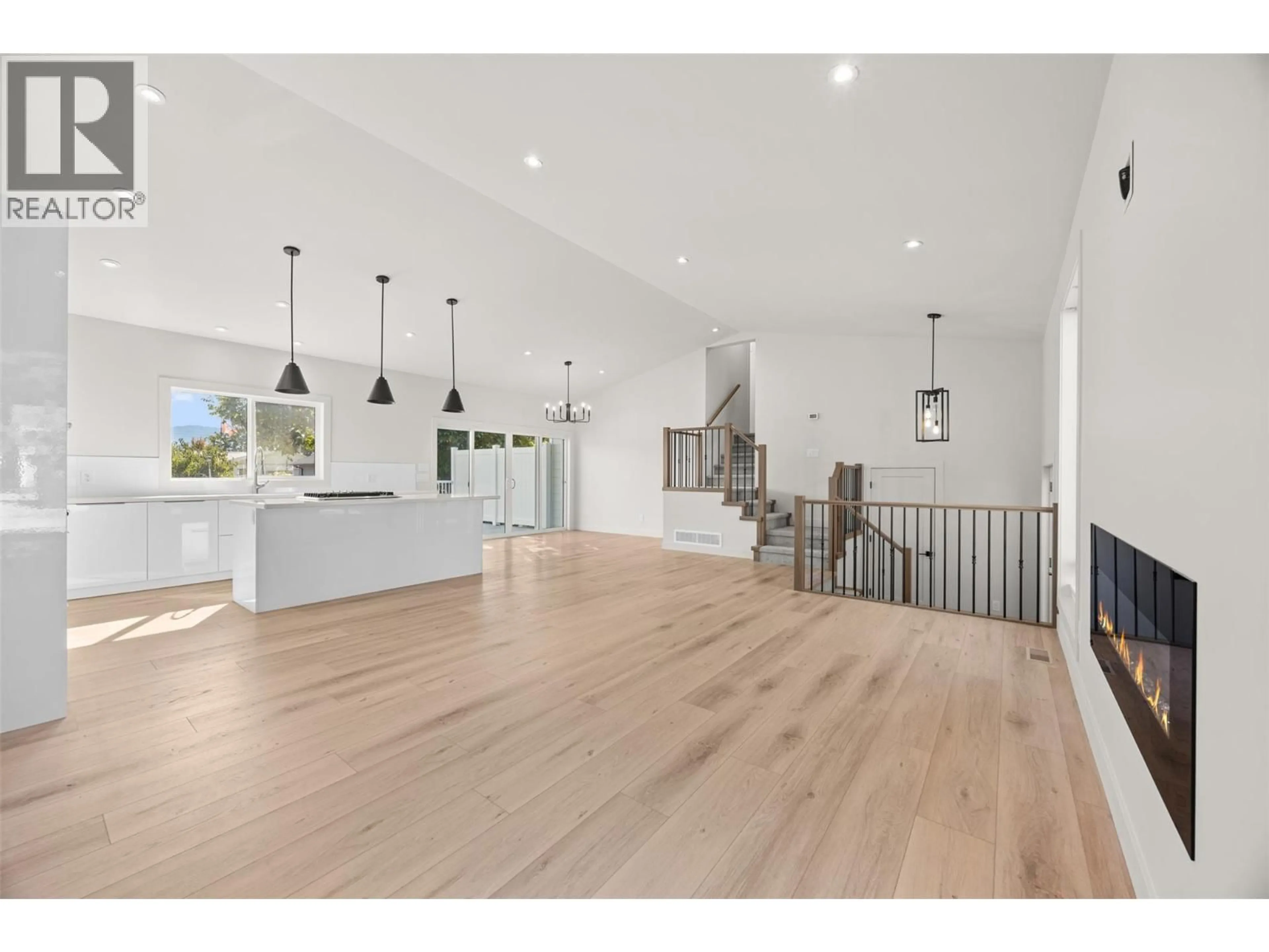 Open concept kitchen, wood/laminate floor for 4141 SAN CLEMENTE AVENUE, Peachland British Columbia V0H1X6