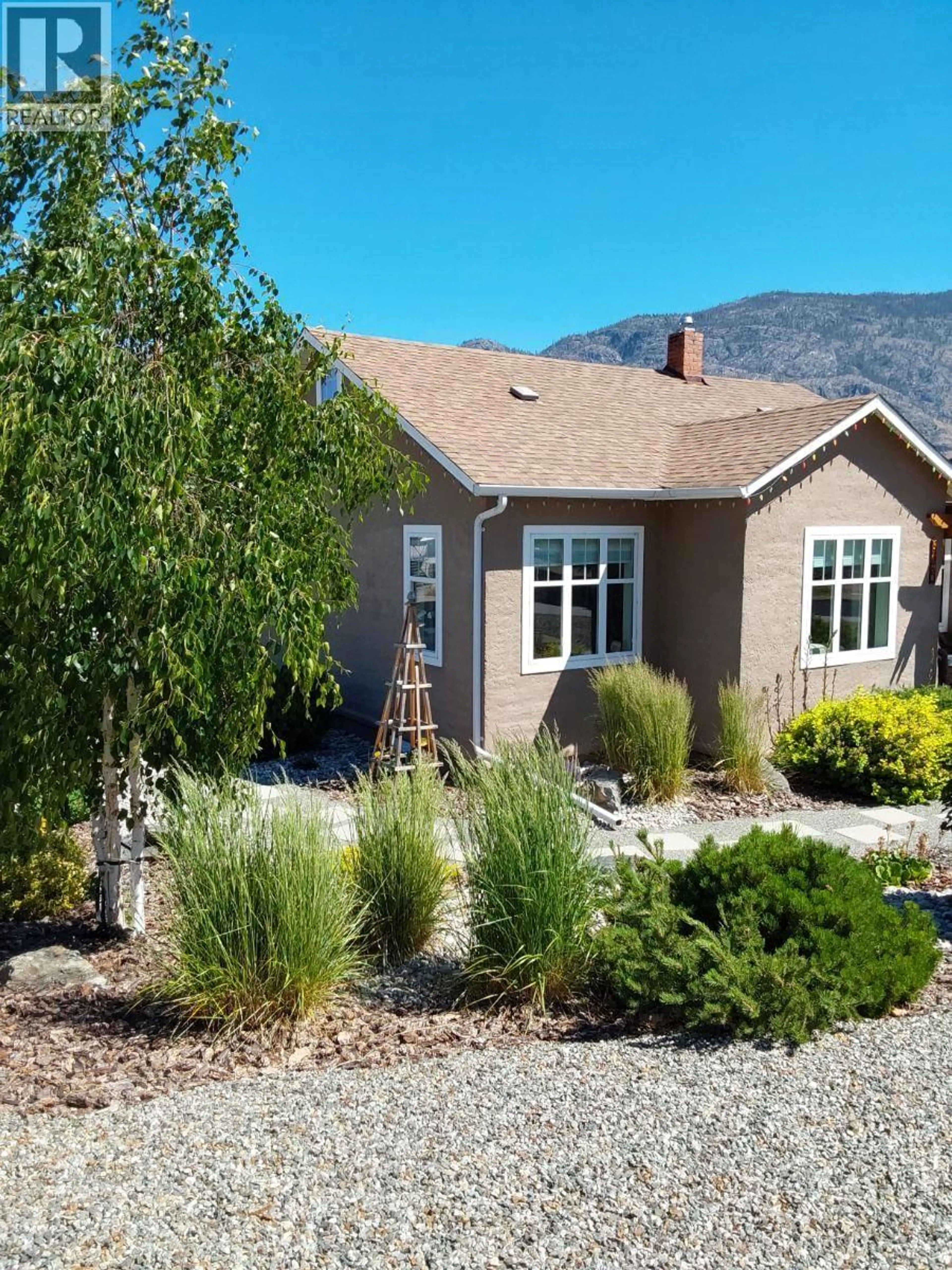 Home with vinyl exterior material, mountain view for 8310 70TH AVENUE, Osoyoos British Columbia V0H1V7