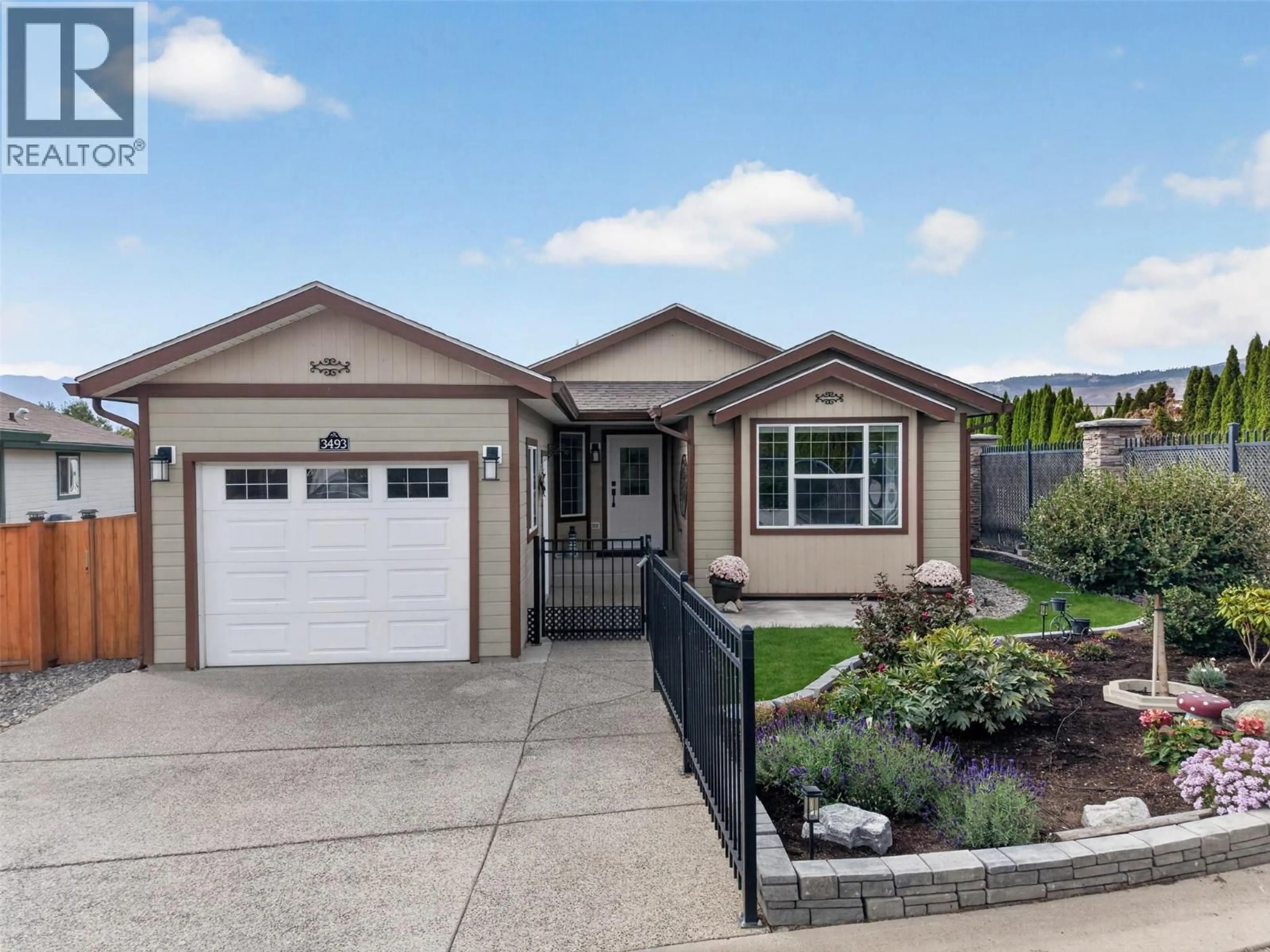 Home with vinyl exterior material, street for 3493 OAK CRESCENT, West Kelowna British Columbia V4T3A5