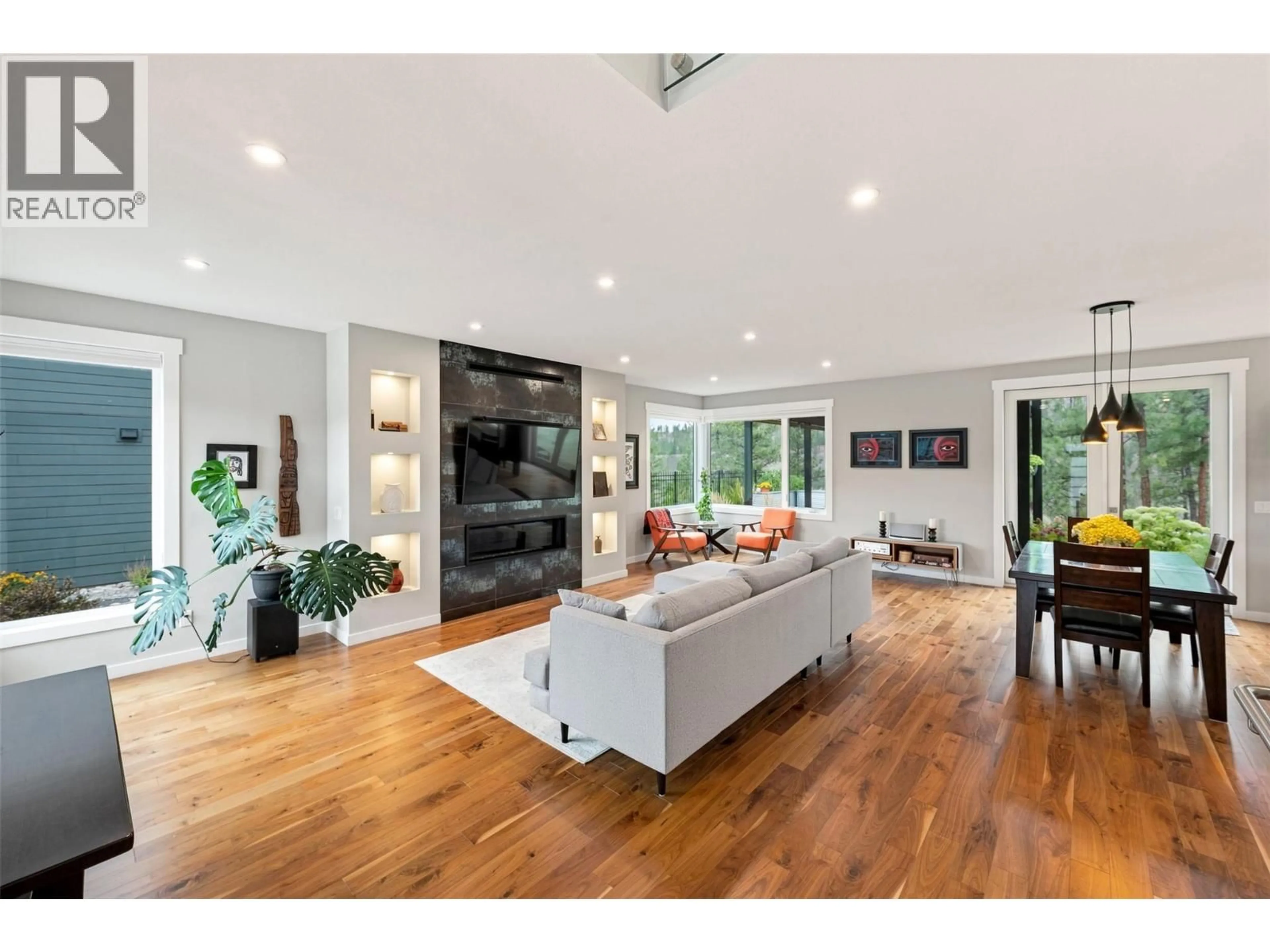 Living room with furniture, wood/laminate floor for 1033 ANTLER DRIVE, Penticton British Columbia V2A0C8