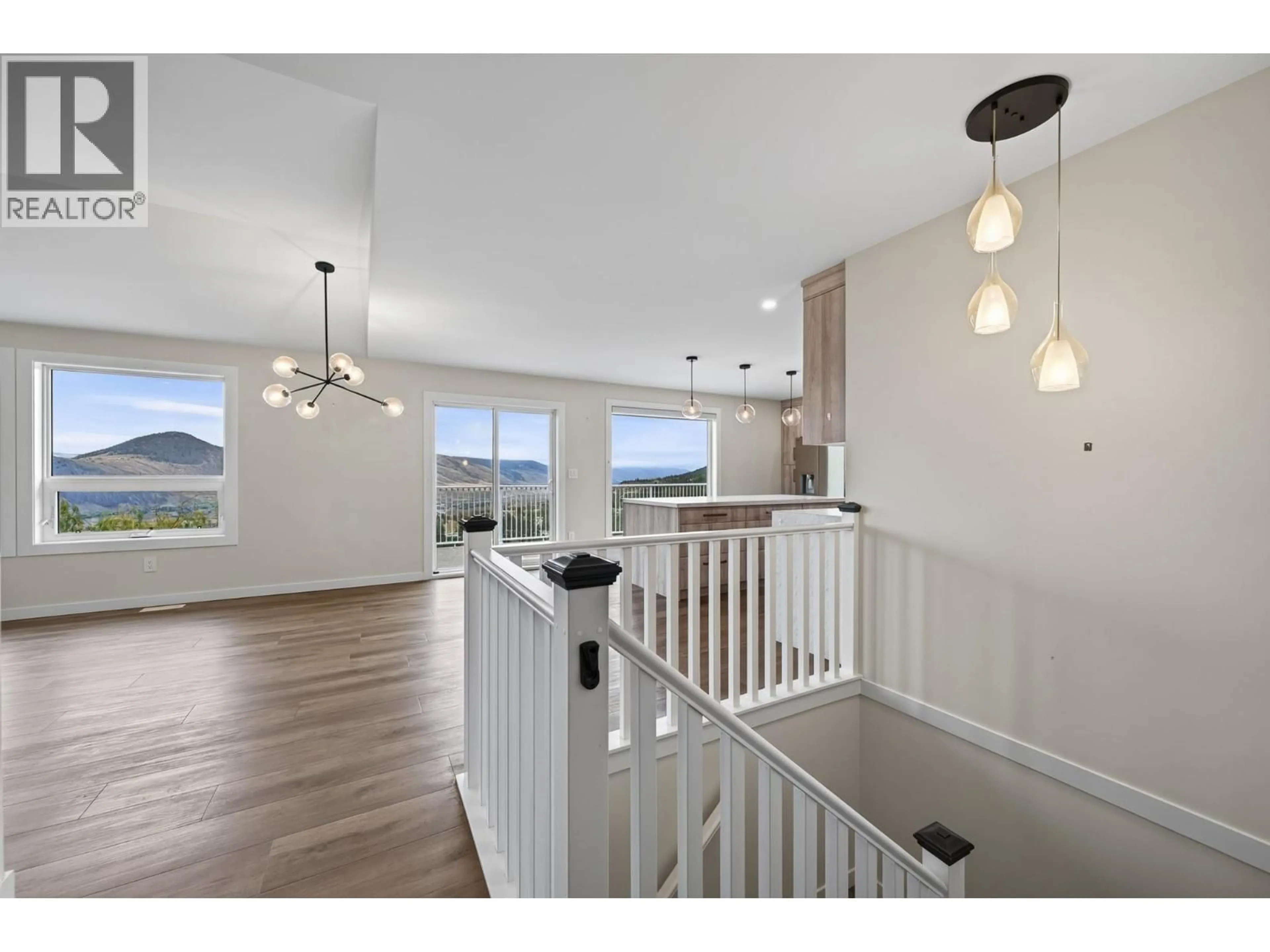 Open concept kitchen, wood/laminate floor for 318 GLENEAGLES DRIVE, Kamloops British Columbia V2E1Z4