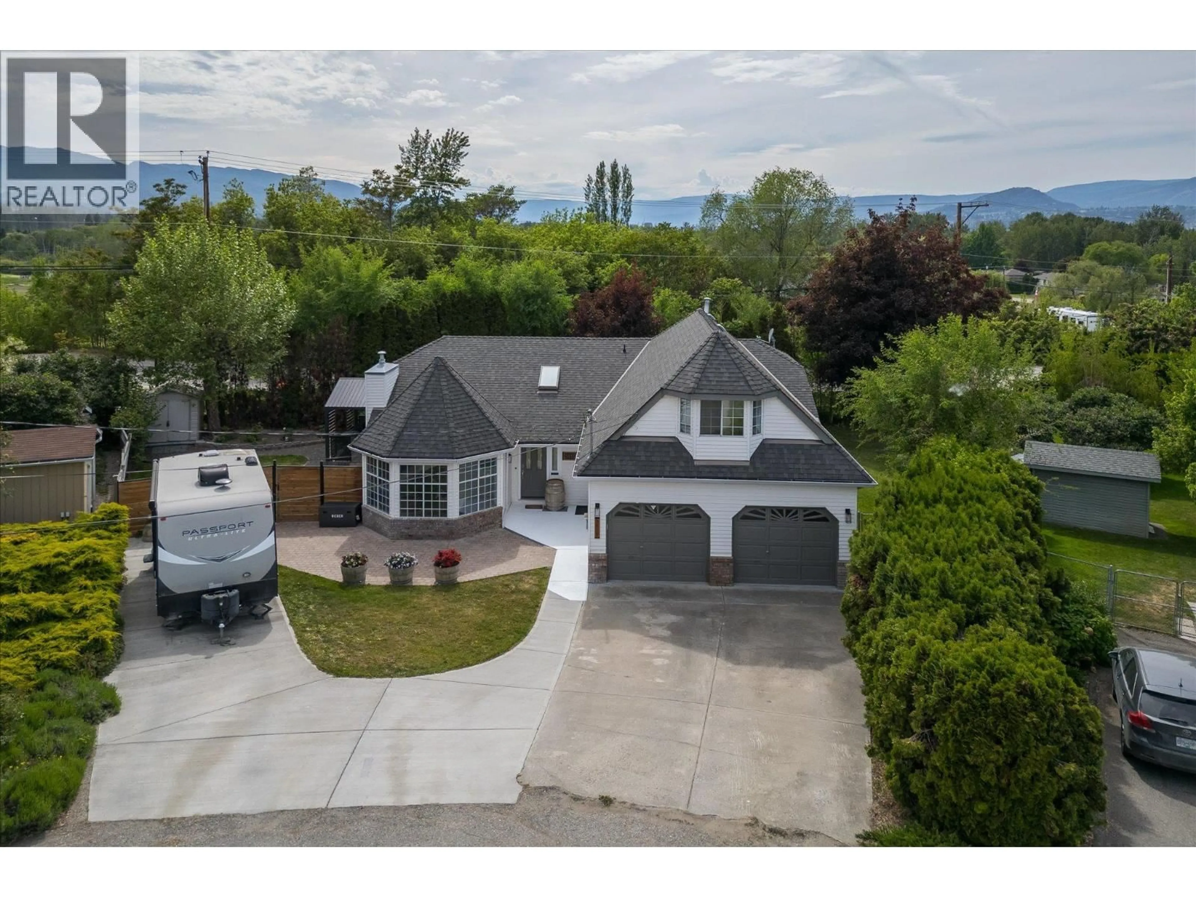 A pic from outside/outdoor area/front of a property/back of a property/a pic from drone, mountain view for 3418 MARIPOSA COURT, Kelowna British Columbia V1W2S9