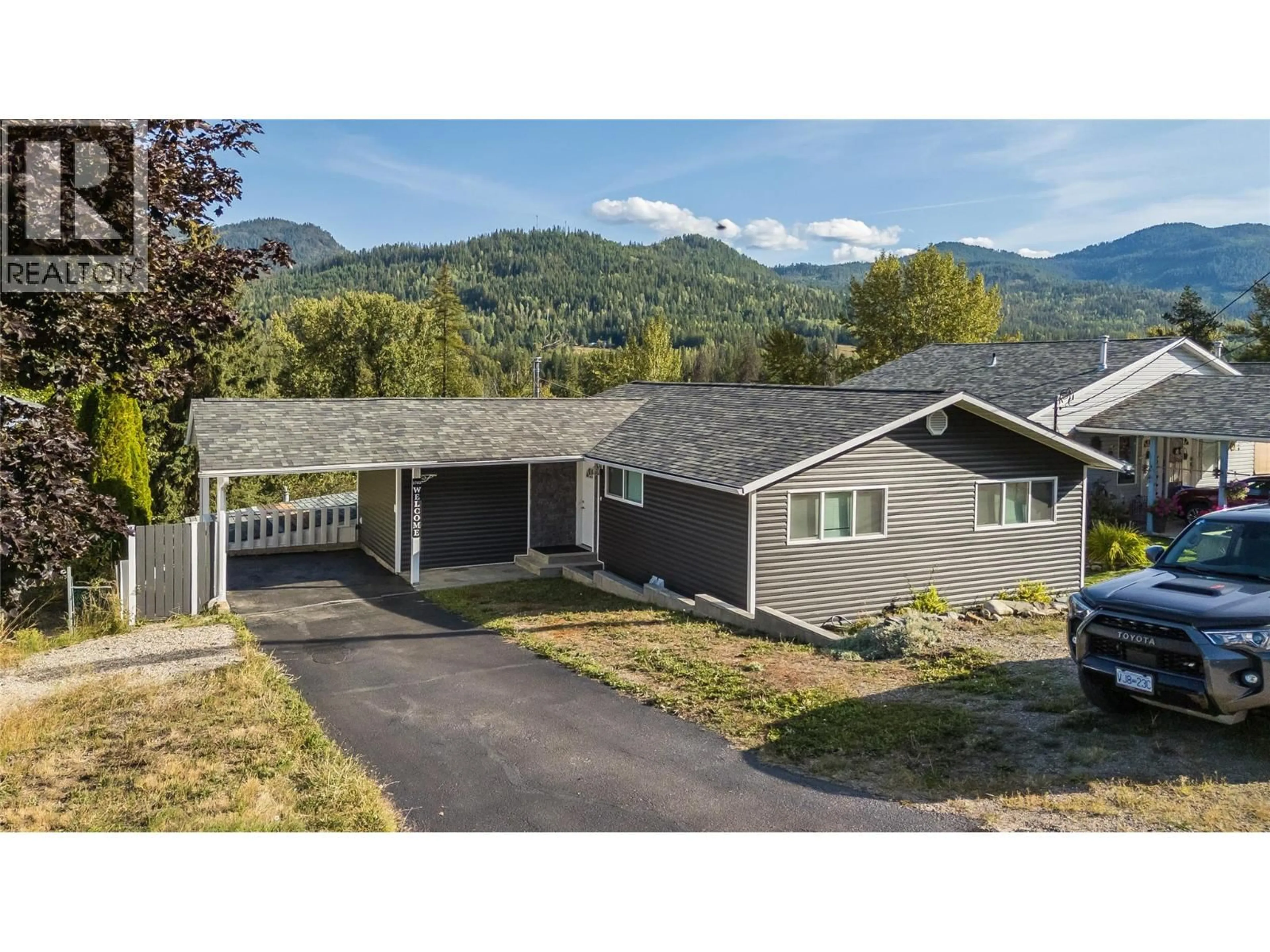 A pic from outside/outdoor area/front of a property/back of a property/a pic from drone, mountain view for 1762 FIRST STREET, Fruitvale British Columbia V0G1L0