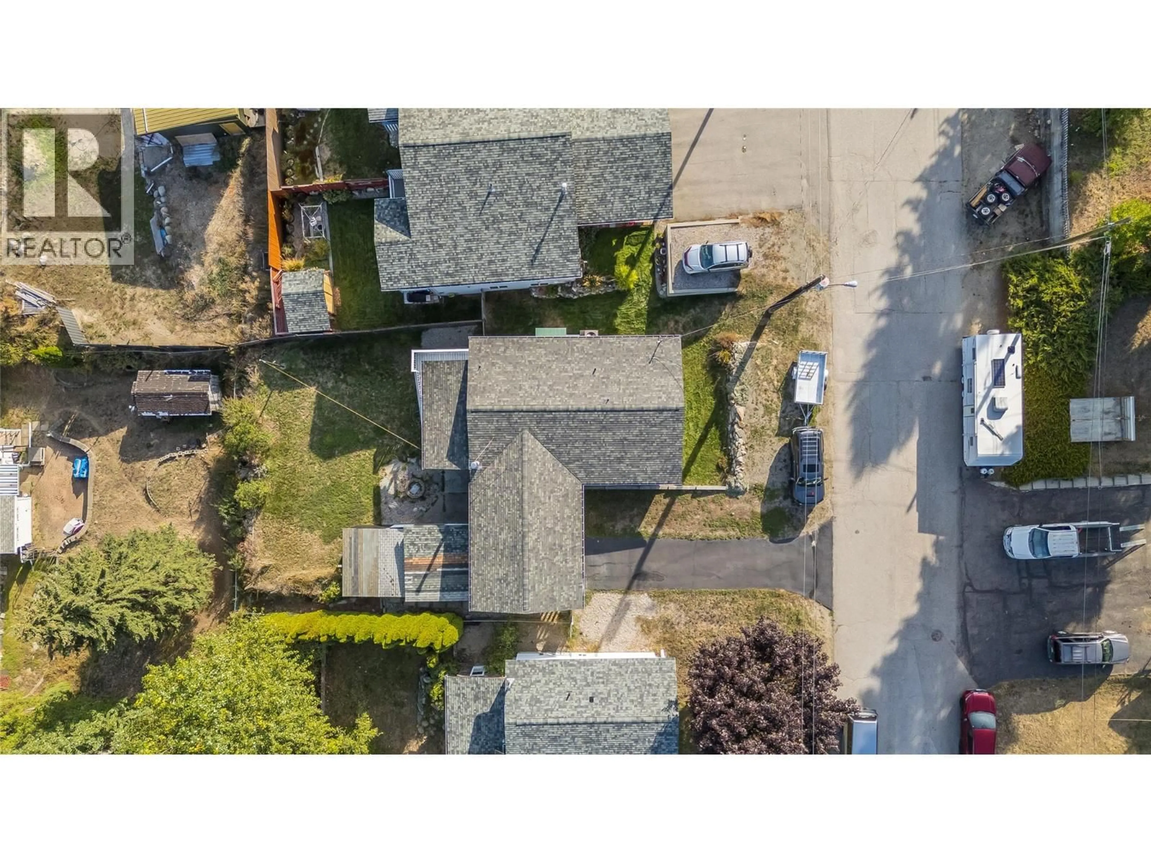 A pic from outside/outdoor area/front of a property/back of a property/a pic from drone, street for 1762 FIRST STREET, Fruitvale British Columbia V0G1L0