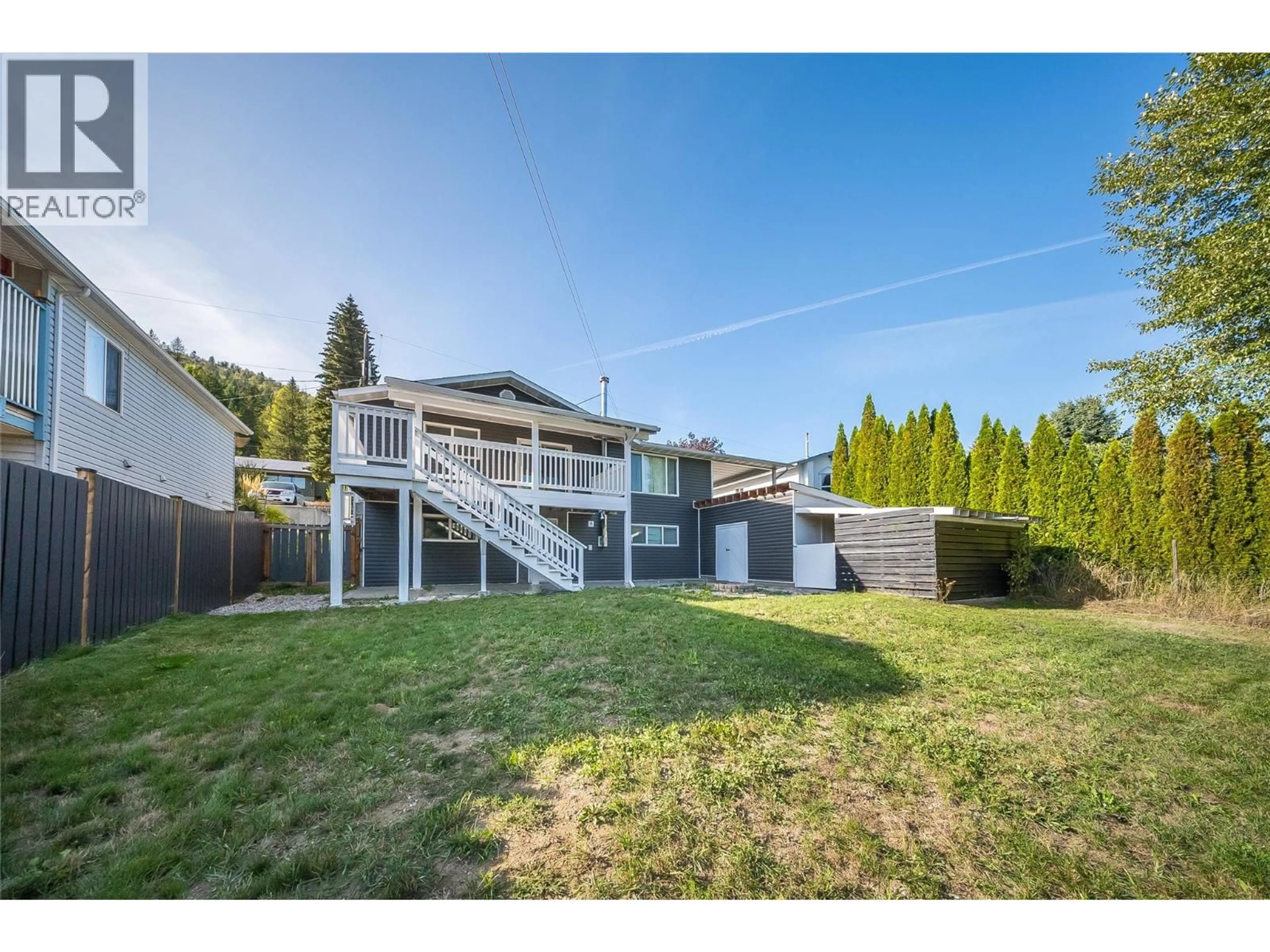 A pic from outside/outdoor area/front of a property/back of a property/a pic from drone, mountain view for 1762 FIRST STREET, Fruitvale British Columbia V0G1L0