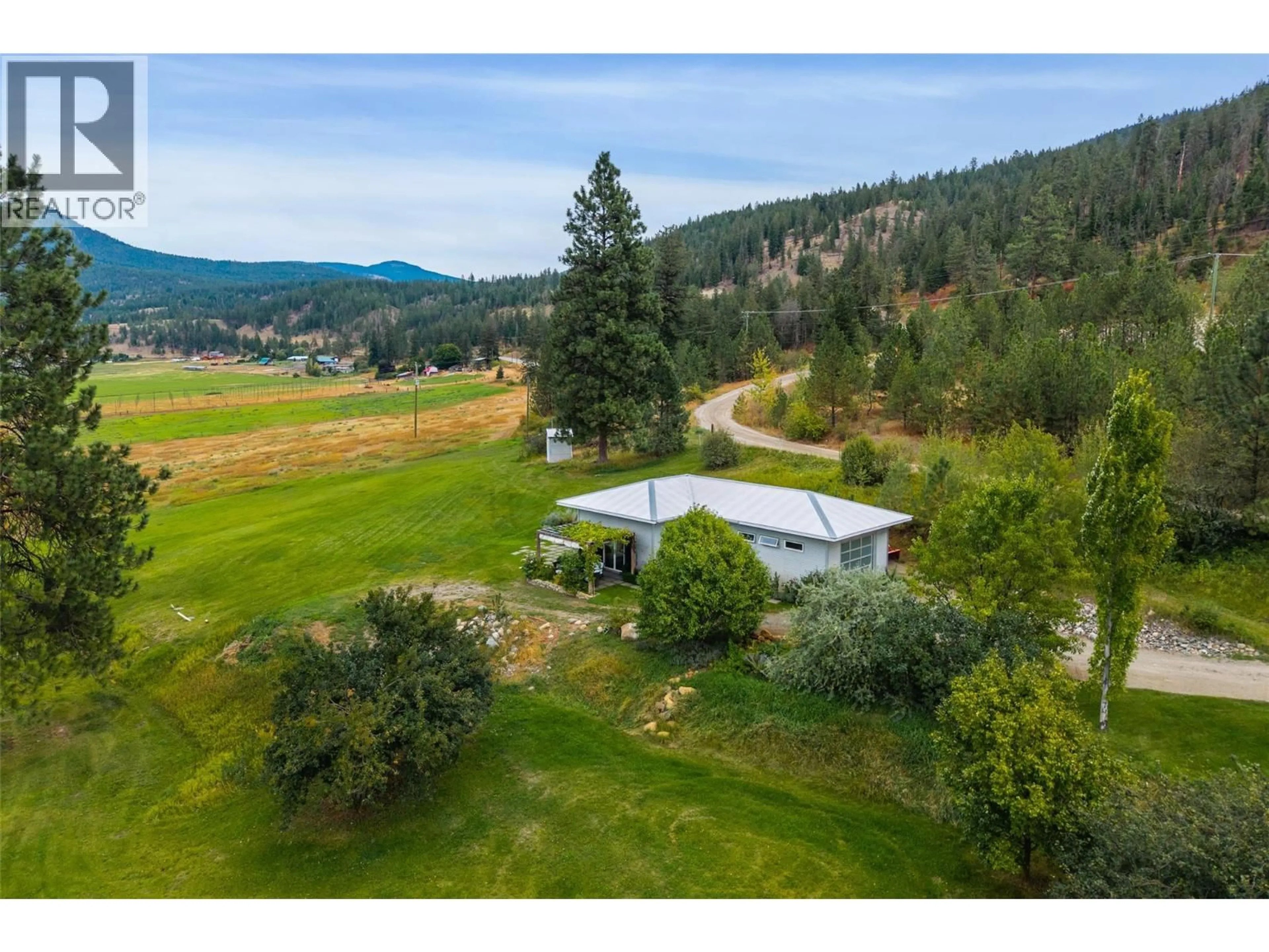 A pic from outside/outdoor area/front of a property/back of a property/a pic from drone, mountain view for 8121 LYONS ROAD, Kamloops British Columbia V0E1Z2