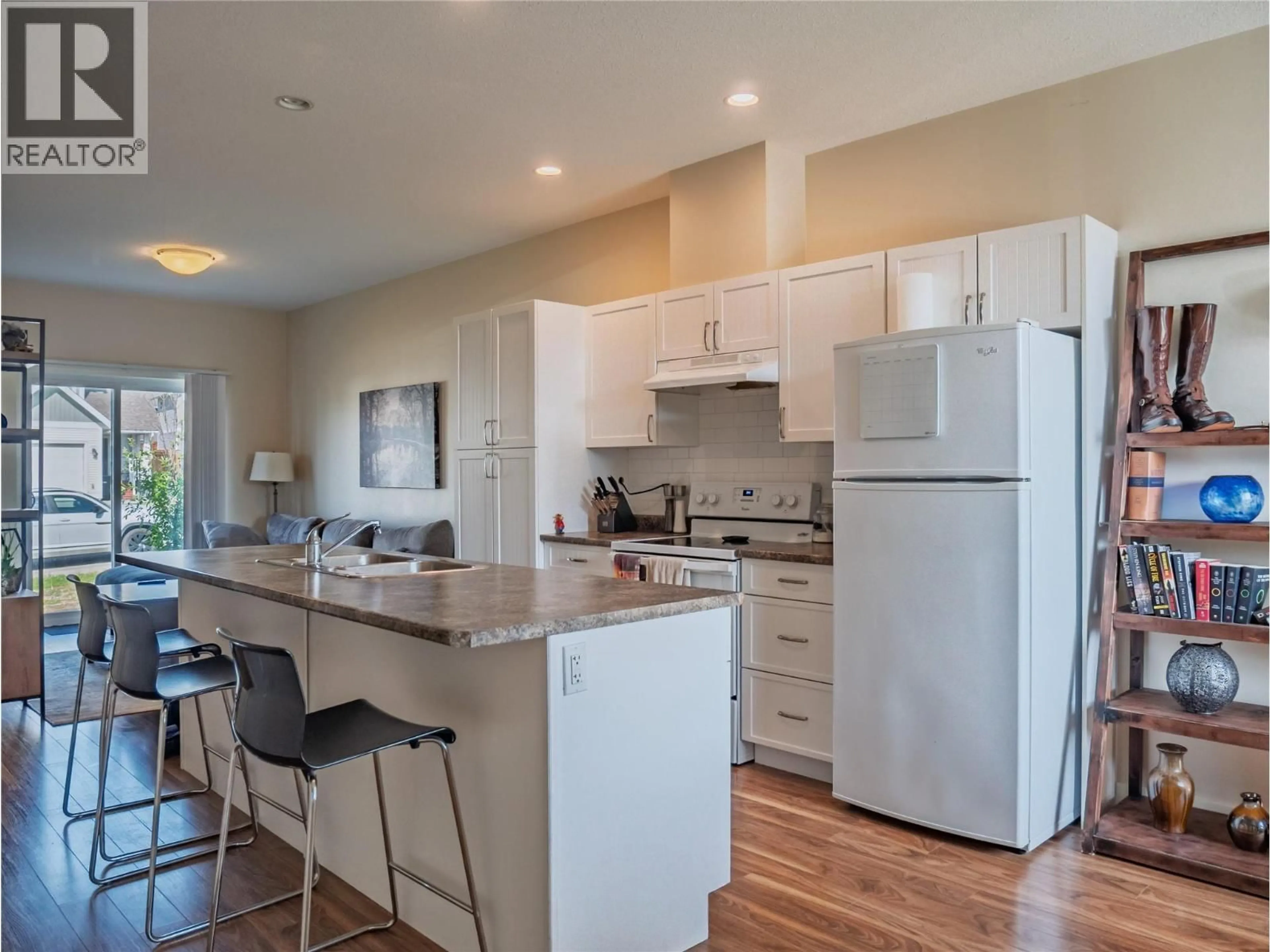 Open concept kitchen, wood/laminate floor for 406 - 1617 88 AVENUE, Dawson Creek British Columbia V1G0E8