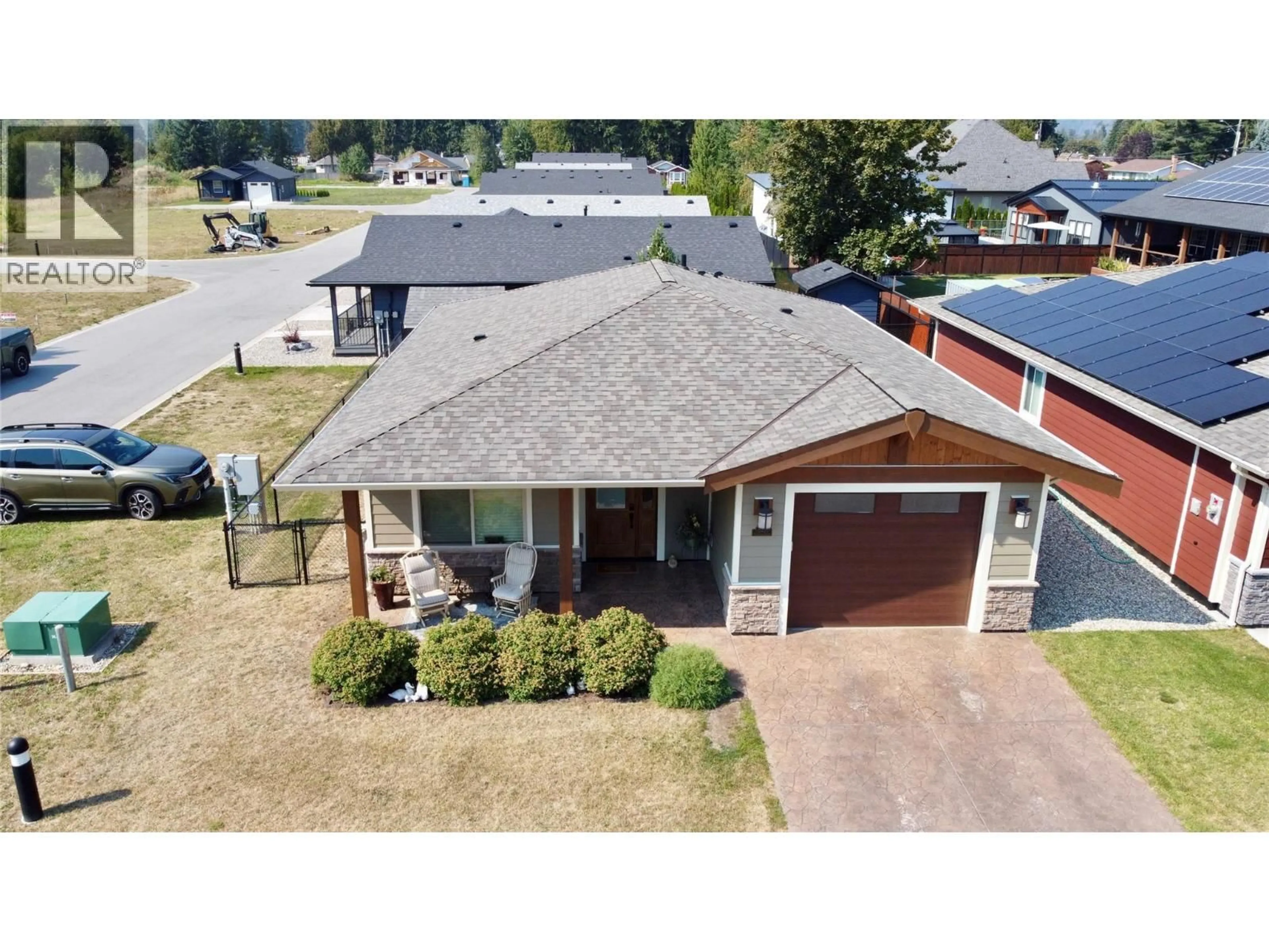 A pic from outside/outdoor area/front of a property/back of a property/a pic from drone, street for 1132 WILLOW ROW, Sicamous British Columbia V0E2V0