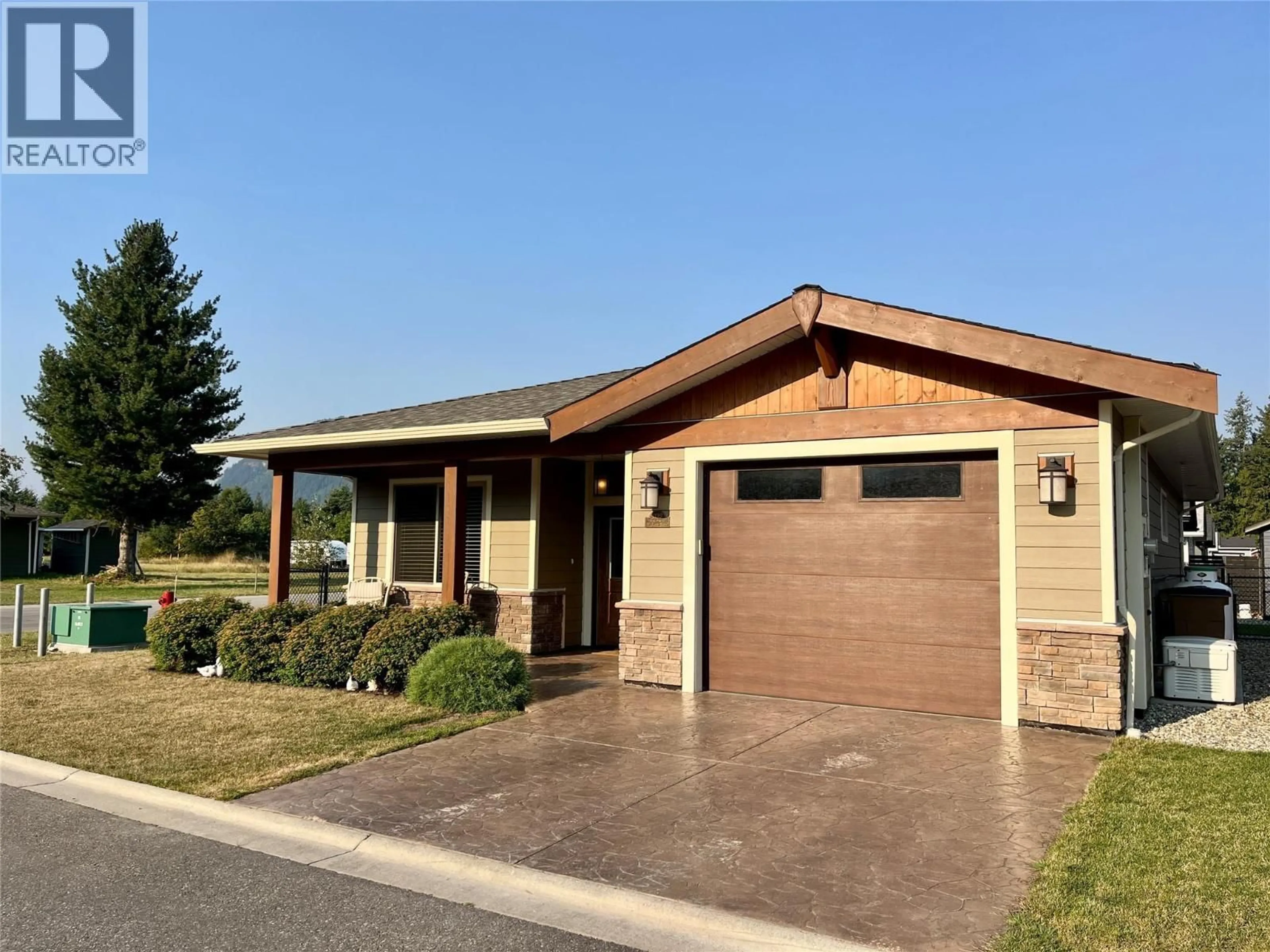 Home with vinyl exterior material, street for 1132 WILLOW ROW, Sicamous British Columbia V0E2V0