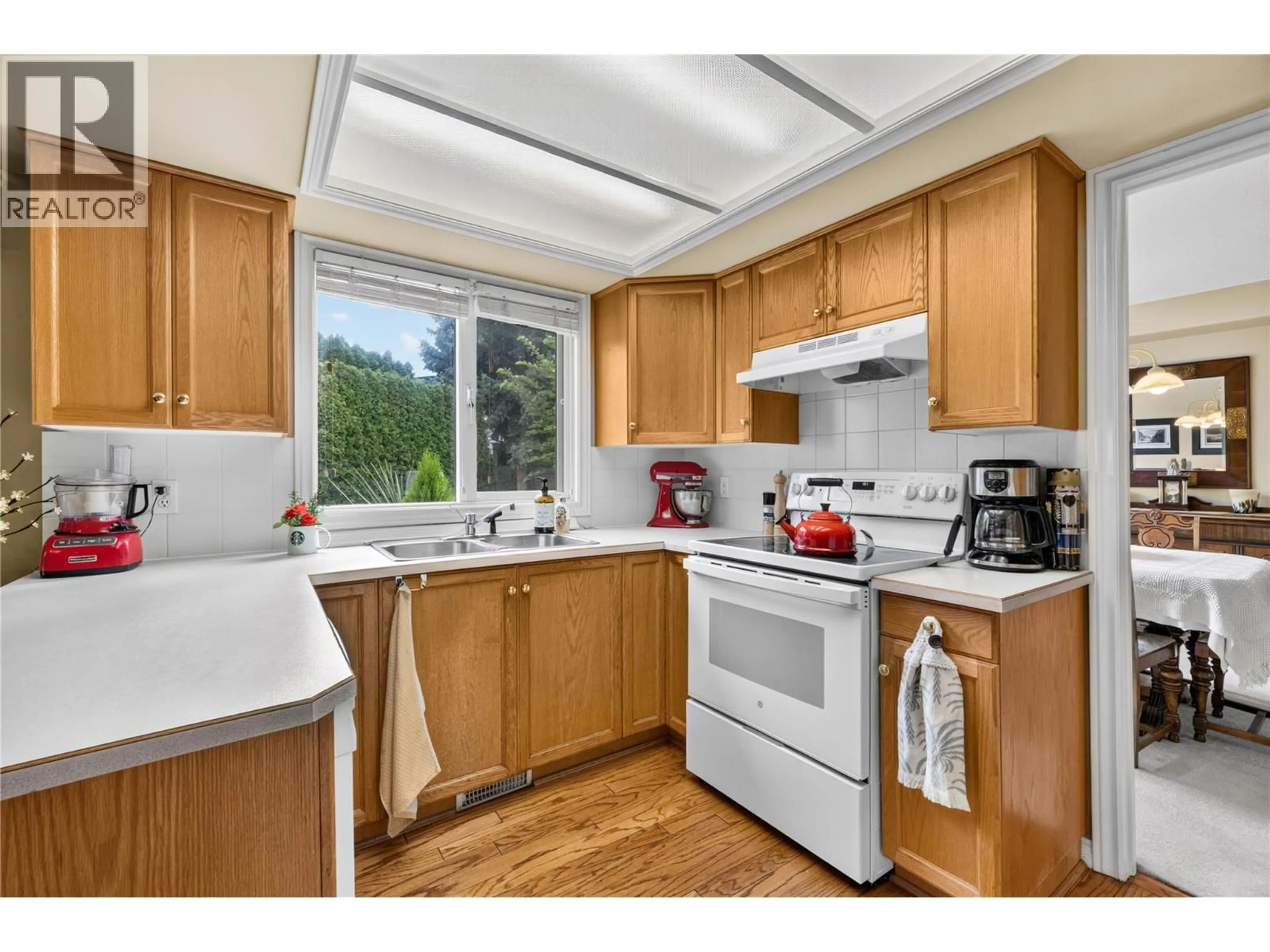Standard kitchen, wood/laminate floor for 4015 LOGIE COURT, Kelowna British Columbia V1W3Y6