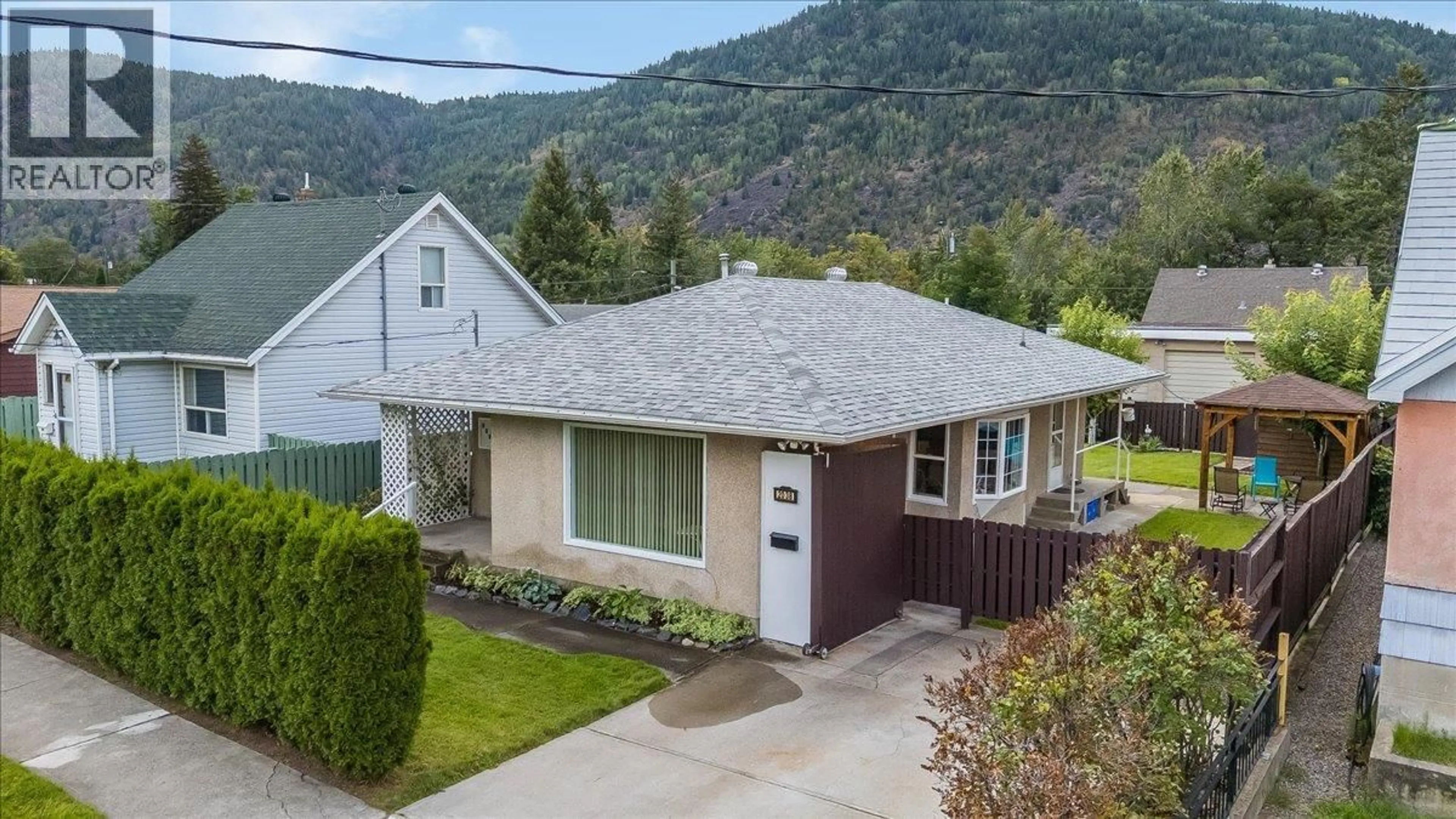 A pic from outside/outdoor area/front of a property/back of a property/a pic from drone, mountain view for 2038 SIXTH AVENUE, Trail British Columbia V1R3B5