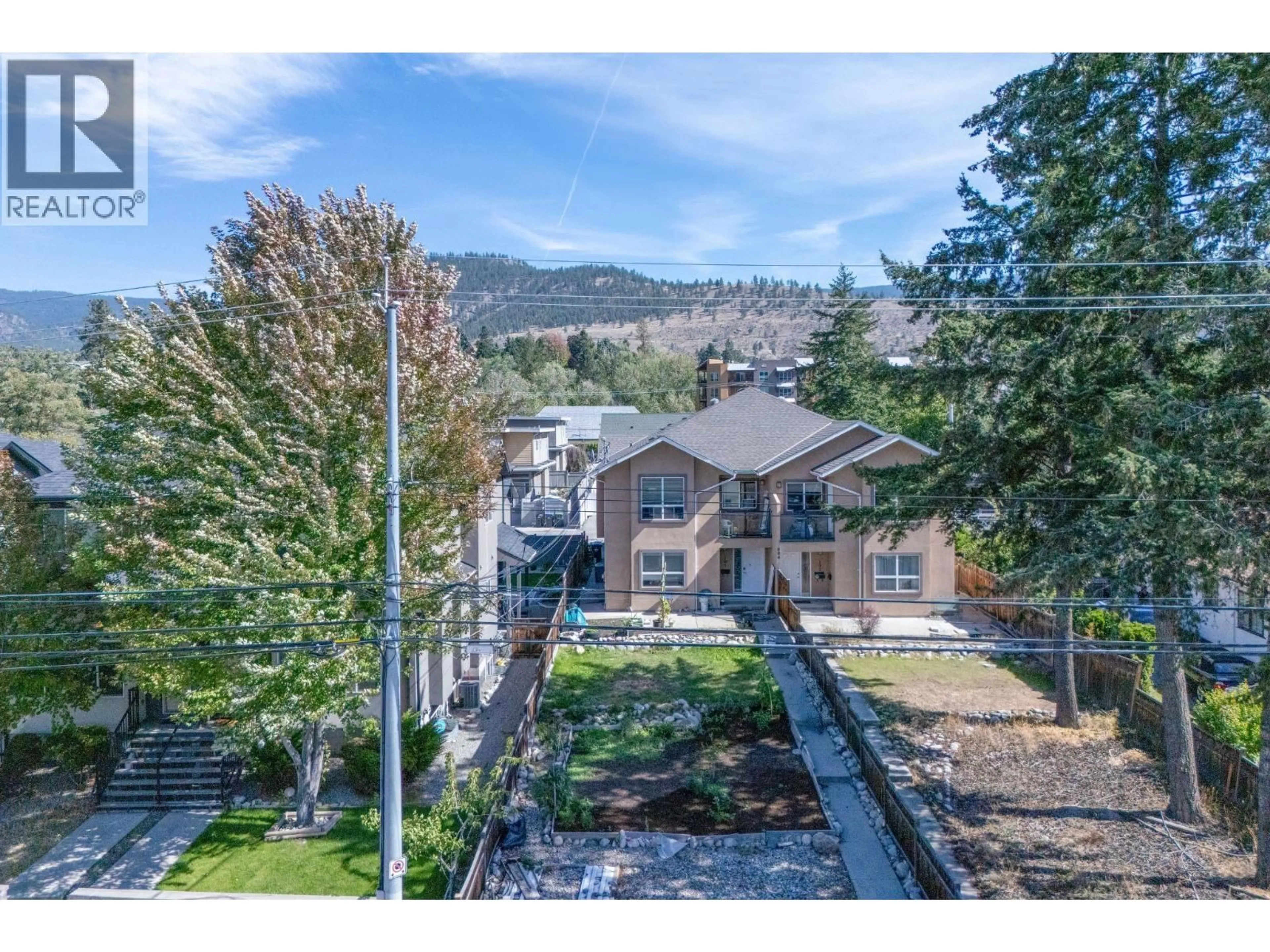 A pic from outside/outdoor area/front of a property/back of a property/a pic from drone, mountain view for 101 - 804 GOVERNMENT STREET, Penticton British Columbia V2A4T3