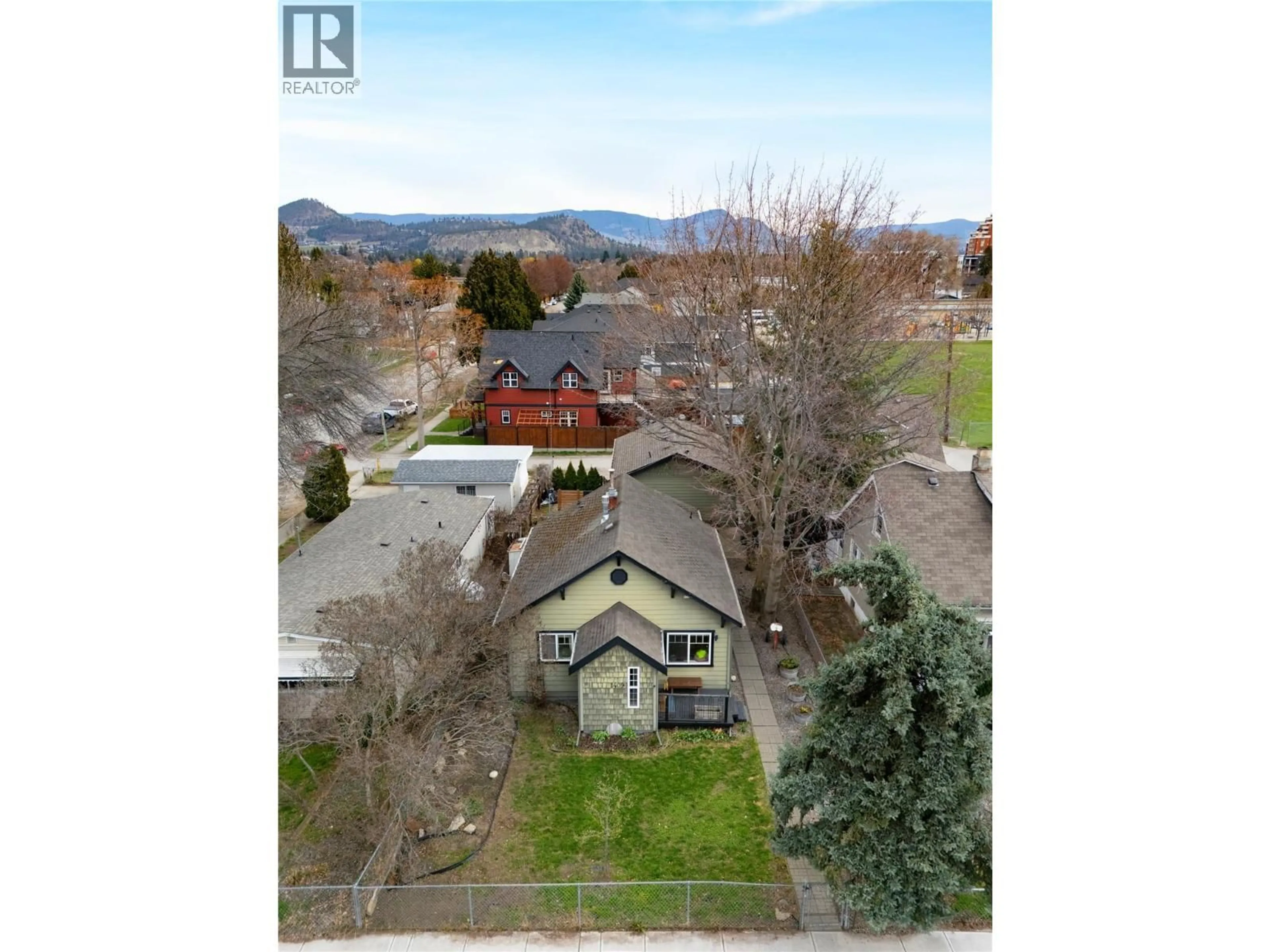 A pic from outside/outdoor area/front of a property/back of a property/a pic from drone, mountain view for 1409 ETHEL STREET, Kelowna British Columbia V1Y2X5