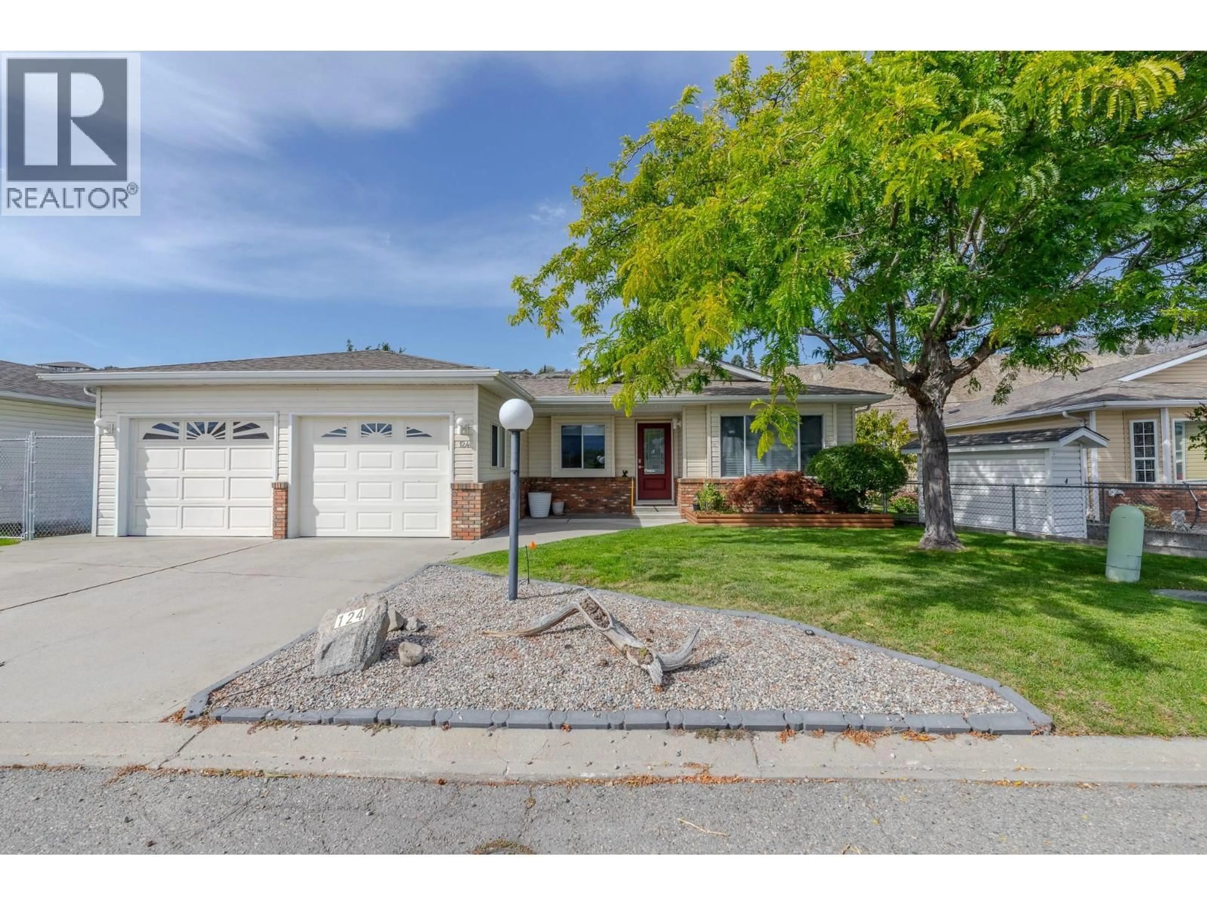 Home with vinyl exterior material, street for 124 HERON DRIVE, Penticton British Columbia V2A8K6