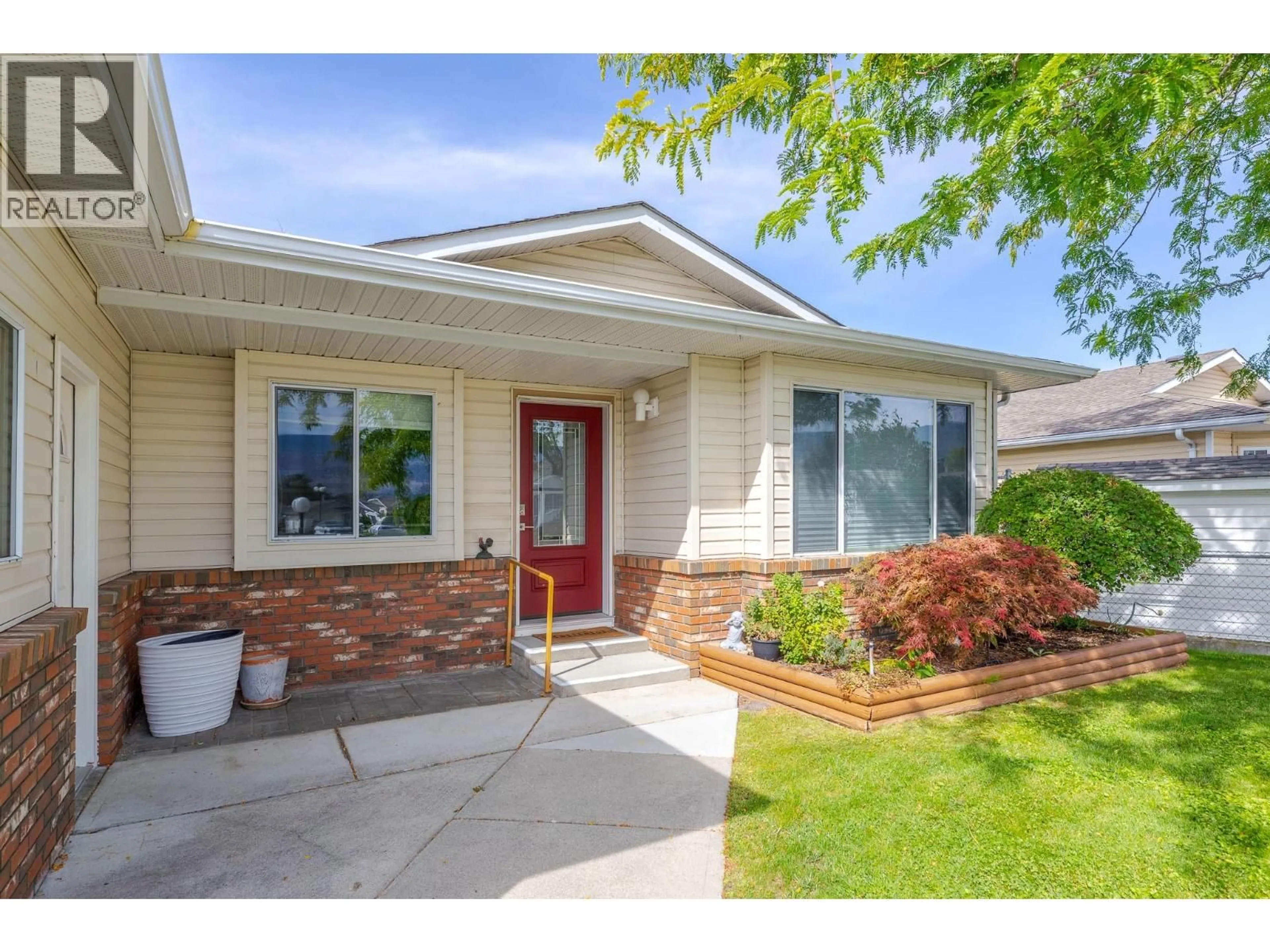 Home with vinyl exterior material, street for 124 HERON DRIVE, Penticton British Columbia V2A8K6