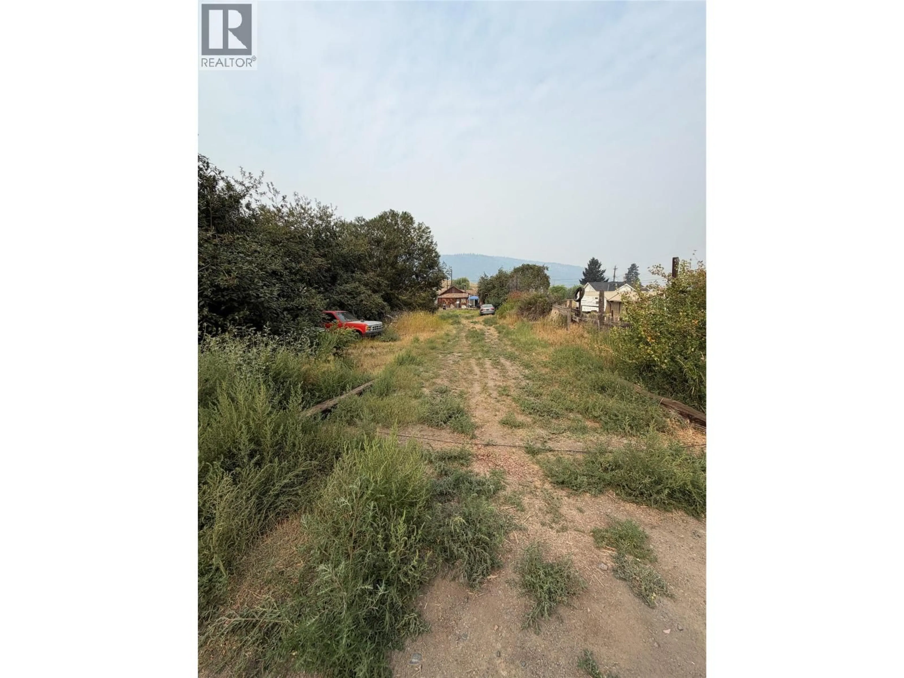 A pic from outside/outdoor area/front of a property/back of a property/a pic from drone, forest/trees view for 1606 PINE STREET, Merritt British Columbia V1K1K8
