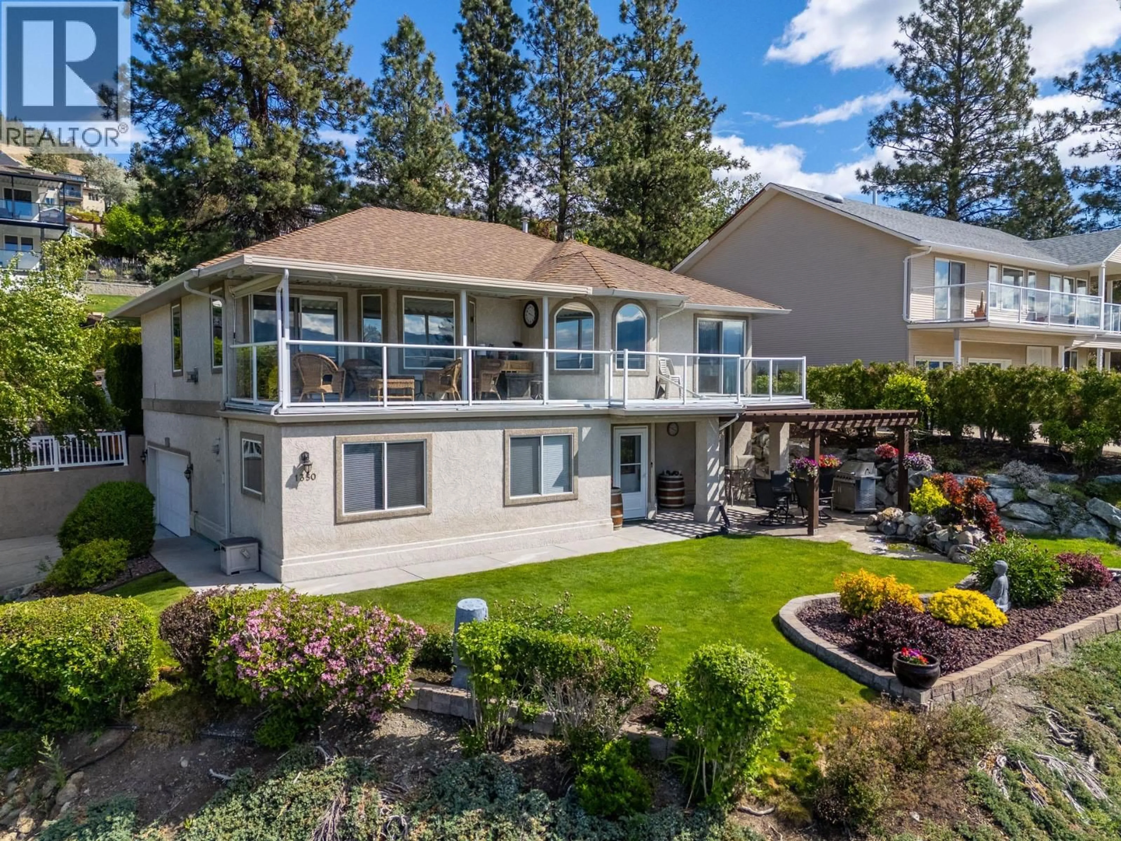 A pic from outside/outdoor area/front of a property/back of a property/a pic from drone, water/lake/river/ocean view for 1350 GREGORY ROAD, West Kelowna British Columbia V1Z3P2