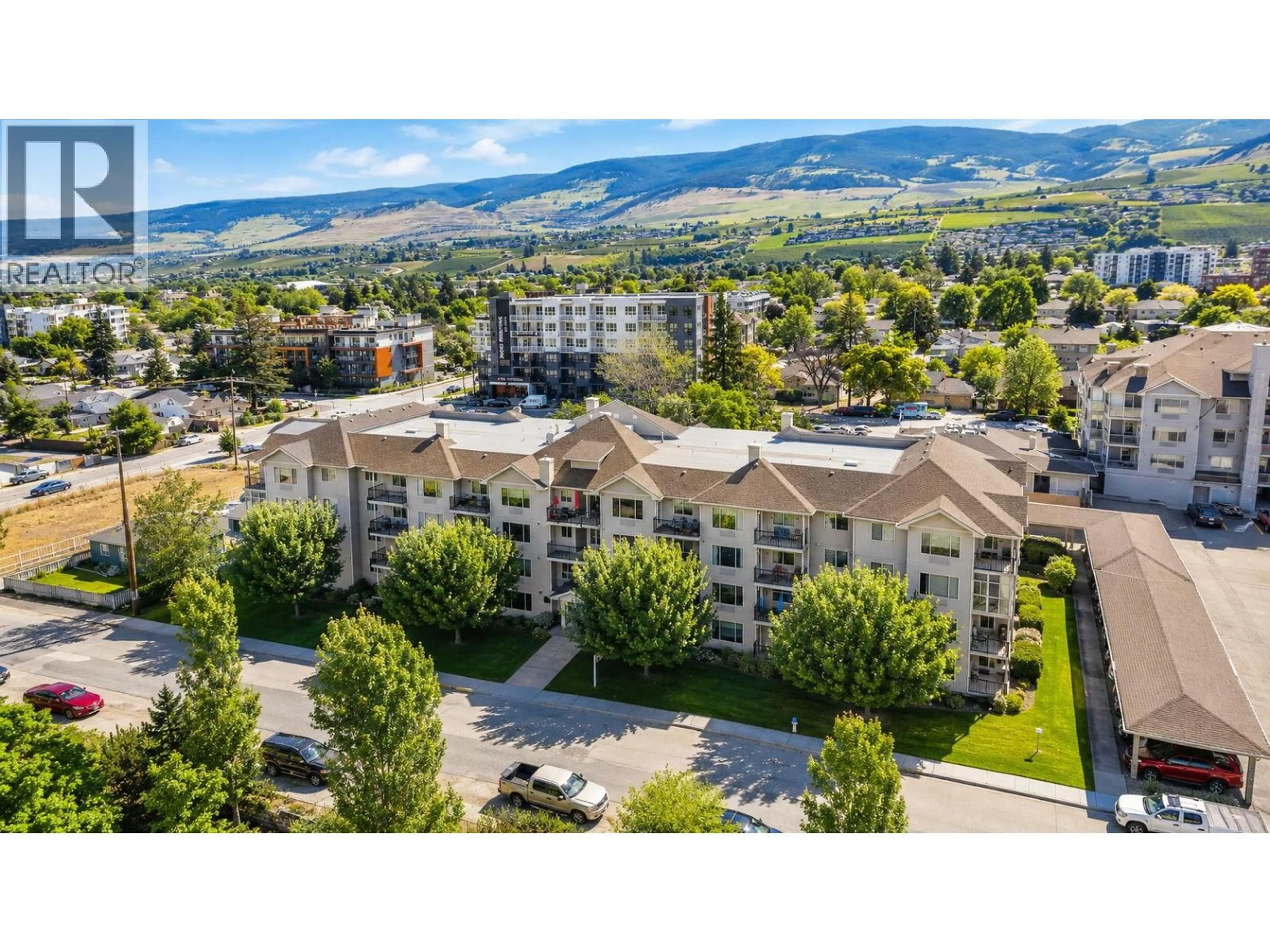 A pic from outside/outdoor area/front of a property/back of a property/a pic from drone, mountain view for 105 - 265 FROELICH ROAD, Kelowna British Columbia V1X3M6