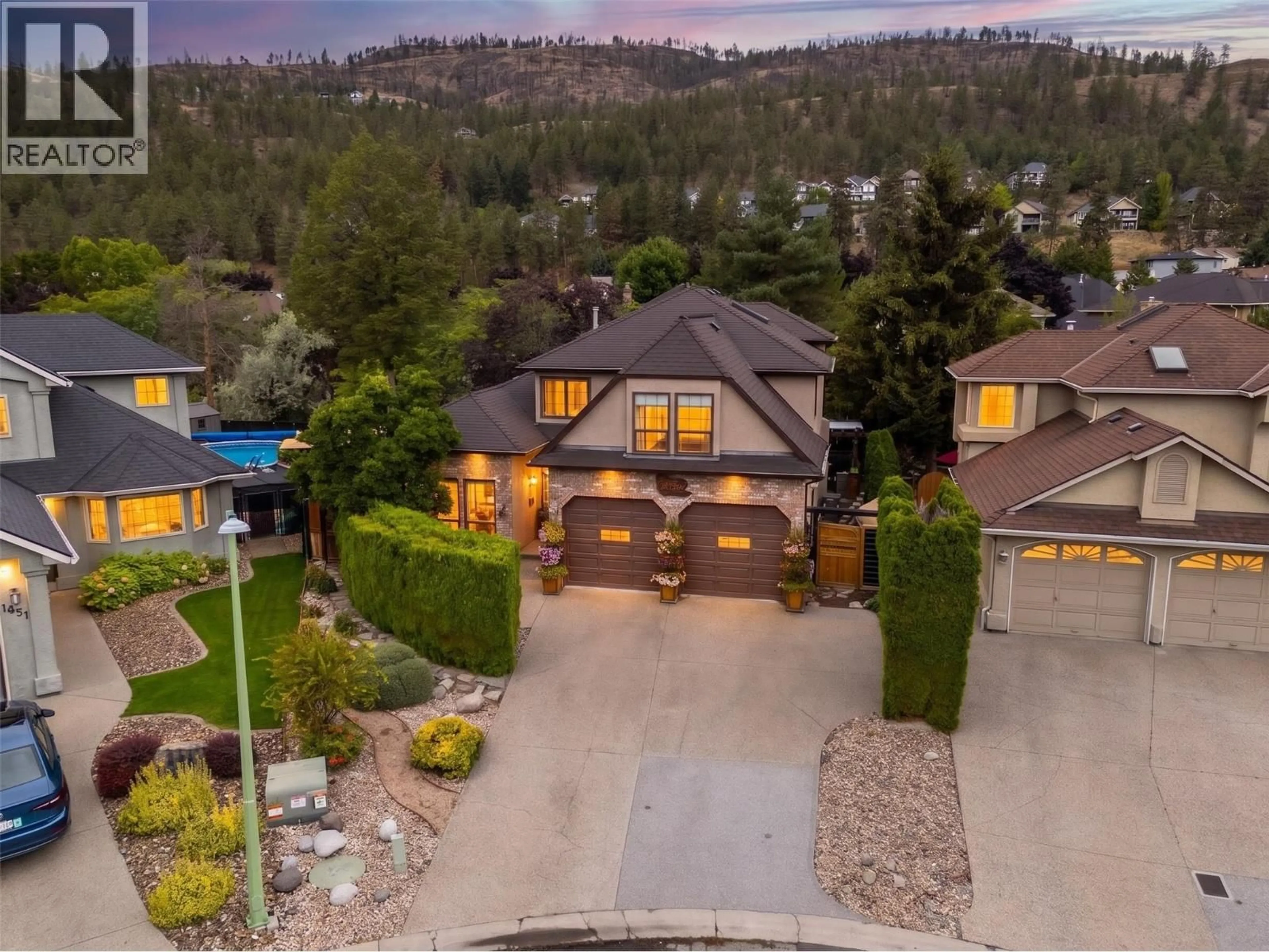 A pic from outside/outdoor area/front of a property/back of a property/a pic from drone, mountain view for 1849 PORTLAND PLACE, Kelowna British Columbia V1V1P9