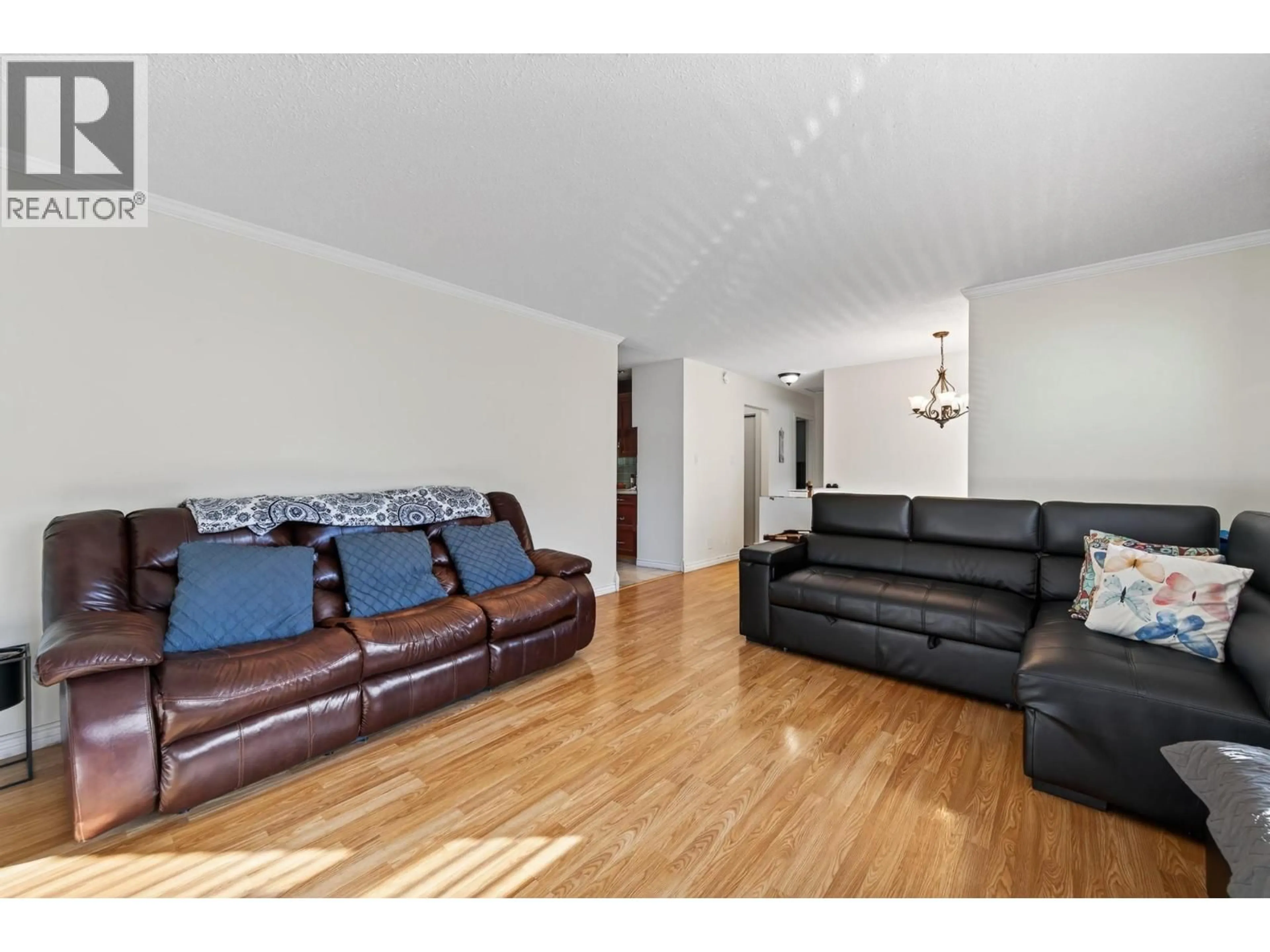Living room with furniture, wood/laminate floor for 3575 WESTSYDE ROAD, Kamloops British Columbia V2B7H5