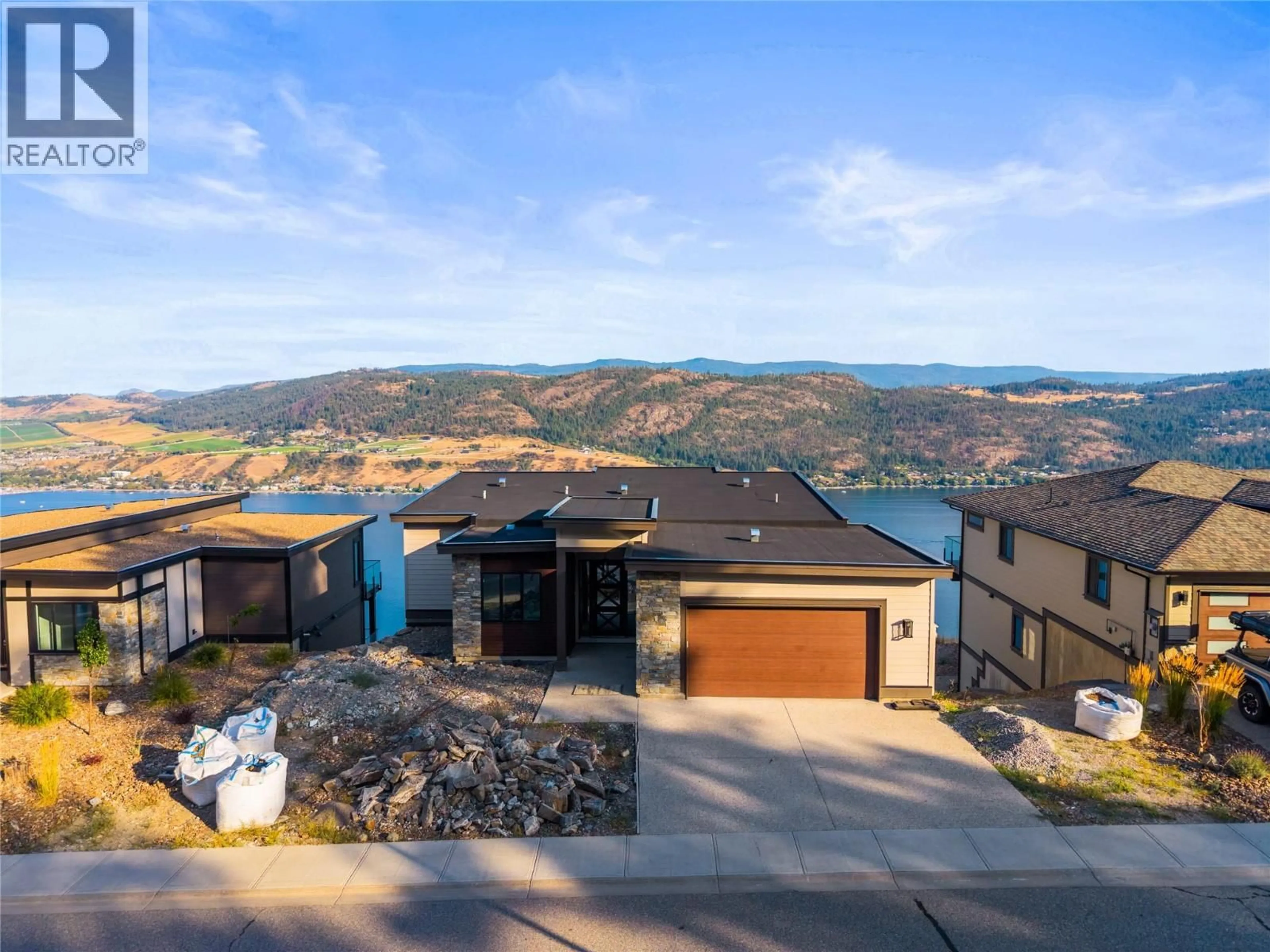 A pic from outside/outdoor area/front of a property/back of a property/a pic from drone, mountain view for 8940 TAVISTOCK ROAD, Vernon British Columbia V1H2L4