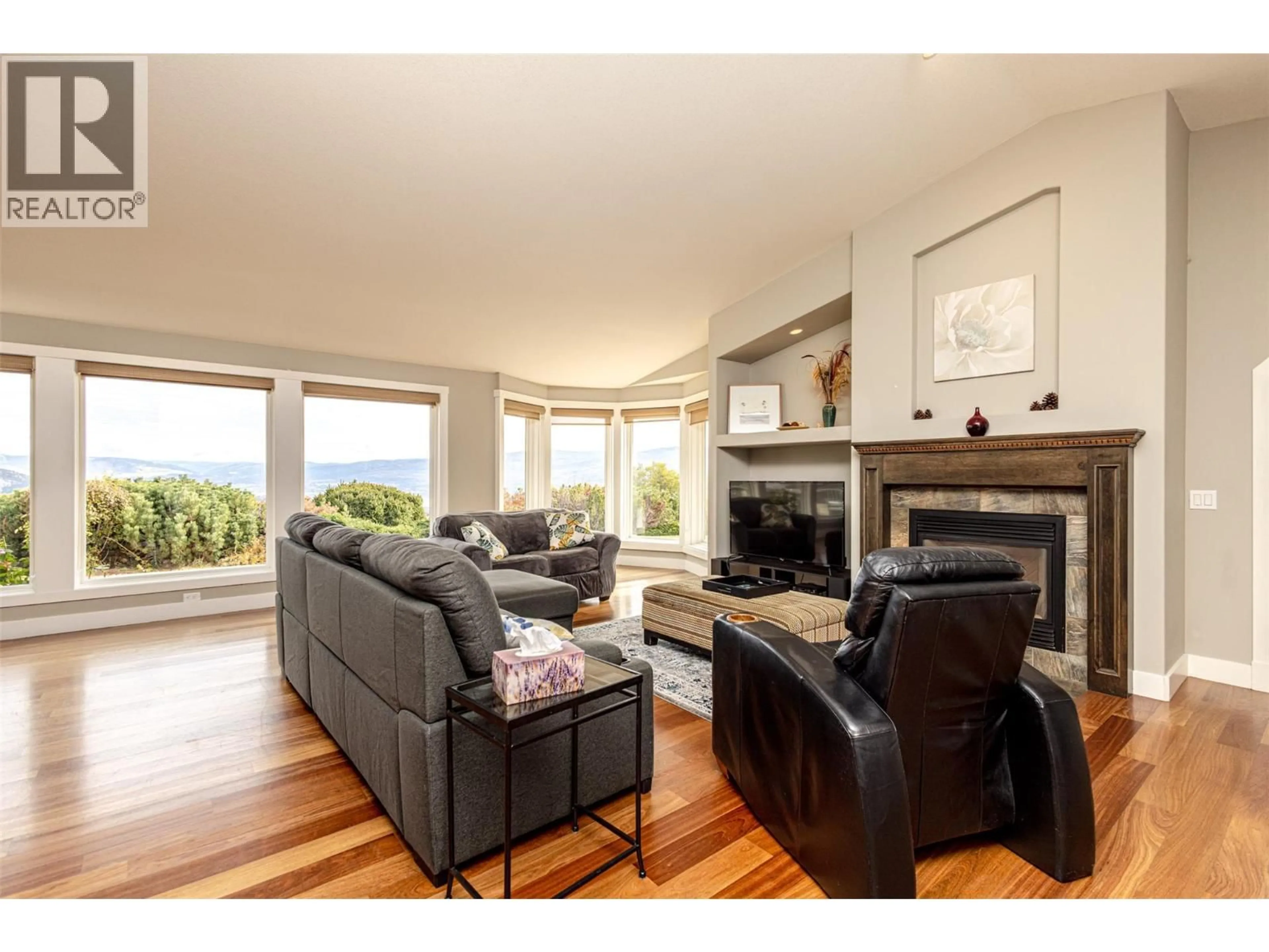 Living room with furniture, wood/laminate floor for 3510 GATES ROAD, West Kelowna British Columbia V4T1A2